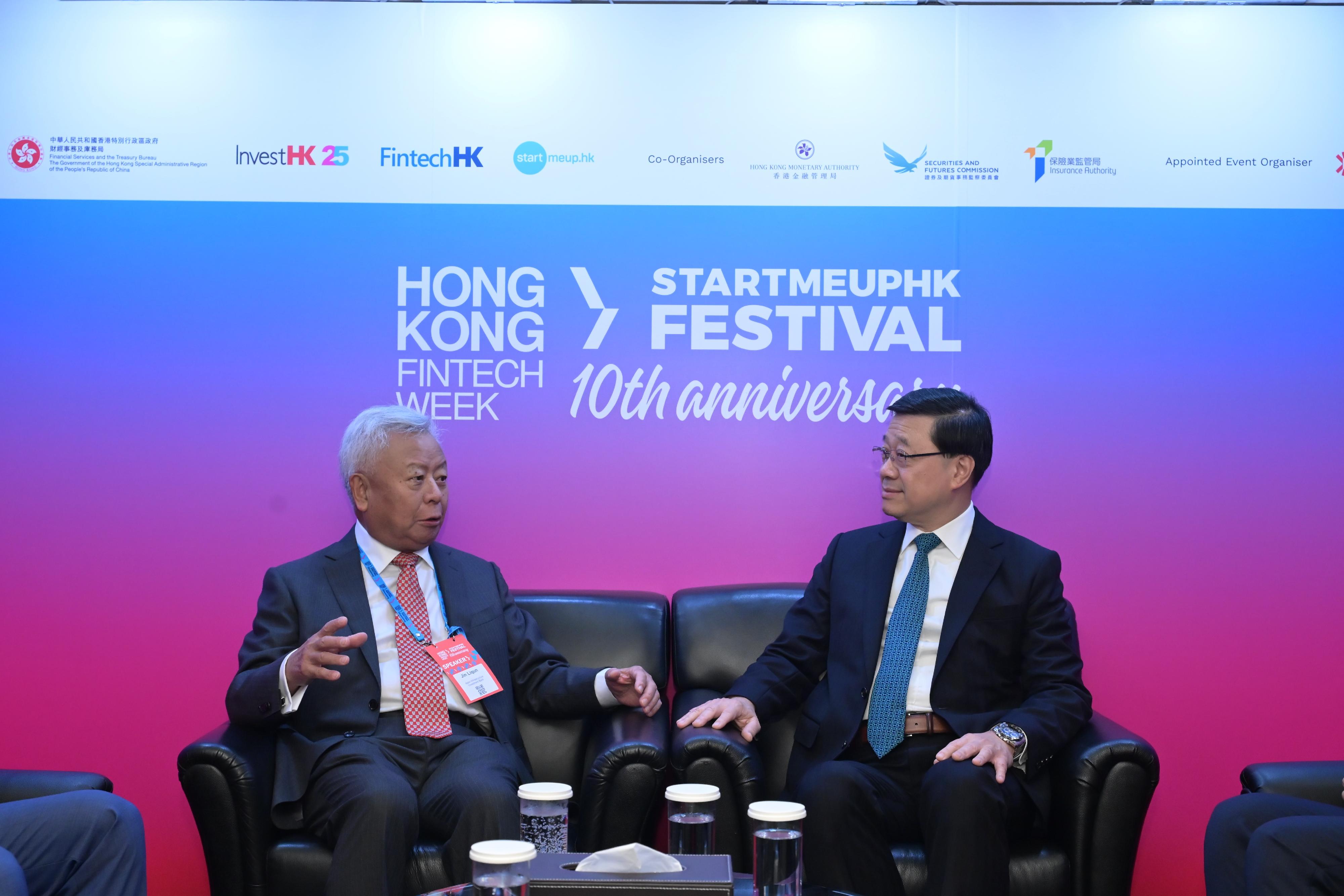 The Chief Executive, Mr John Lee, attended the Hong Kong FinTech Week x StartmeupHK Festival 2025 today (November 3). Photo shows Mr Lee (right) meeting with the President of the Asian Infrastructure Investment Bank, Mr Jin Liqun (left).