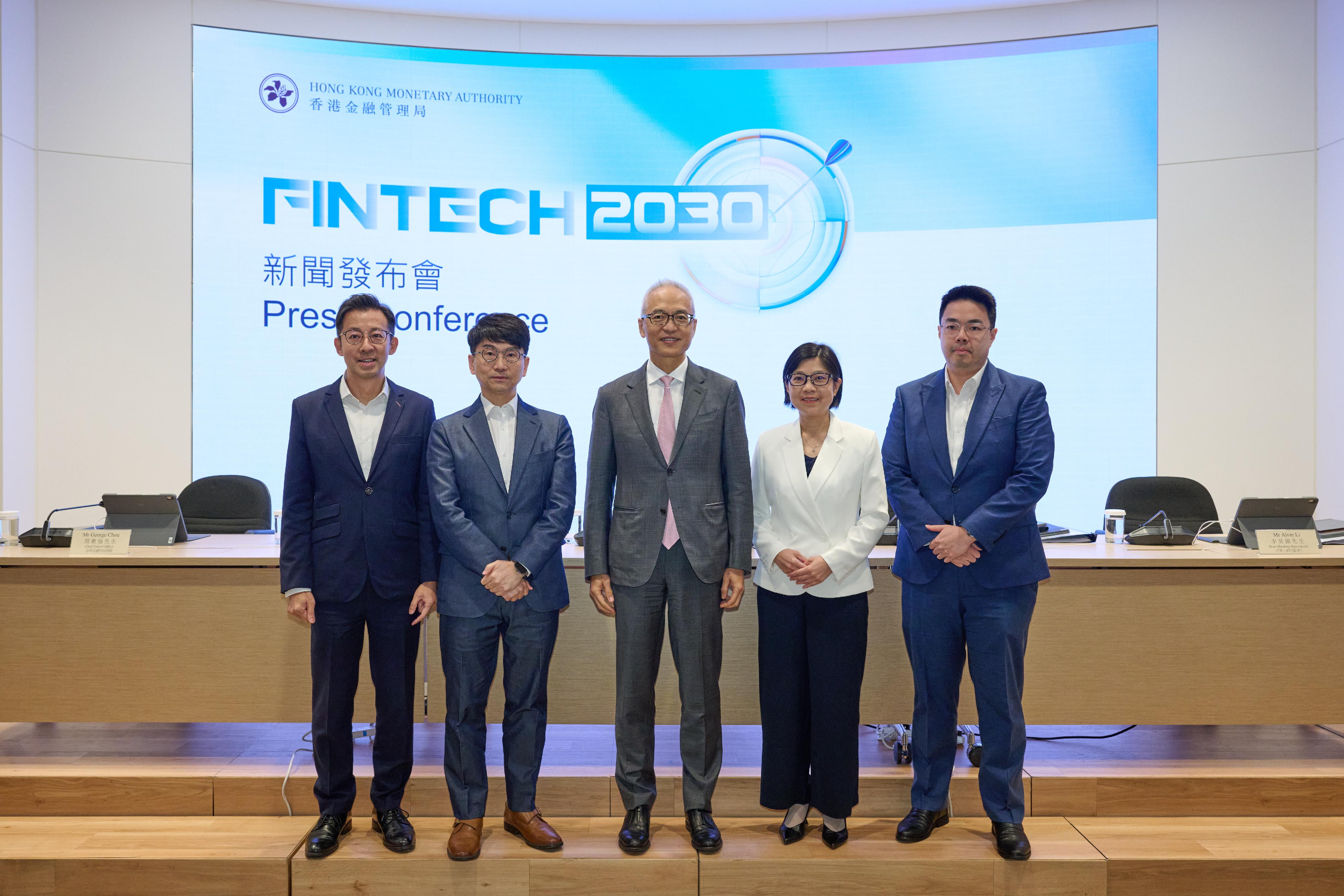 The Hong Kong Monetary Authority (HKMA) today (November 3) unveiled "Fintech 2030", a forward-looking strategy for driving Hong Kong's fintech development, at the Hong Kong FinTech Week 2025. Photo shows Deputy Chief Executive Mr Howard Lee (centre); the Executive Director (Banking Supervision), Ms Carmen Chu (second right); the Executive Director (Financial Infrastructure), Mr Nelson Chow (second left); the Chief Fintech Officer, Mr George Chou (first left); and the Head (Banking Supervision), Mr Alvin Li (first right), of the HKMA, highlighting the details of "Fintech 2030" at the Hong Kong FinTech Week 2025. 
