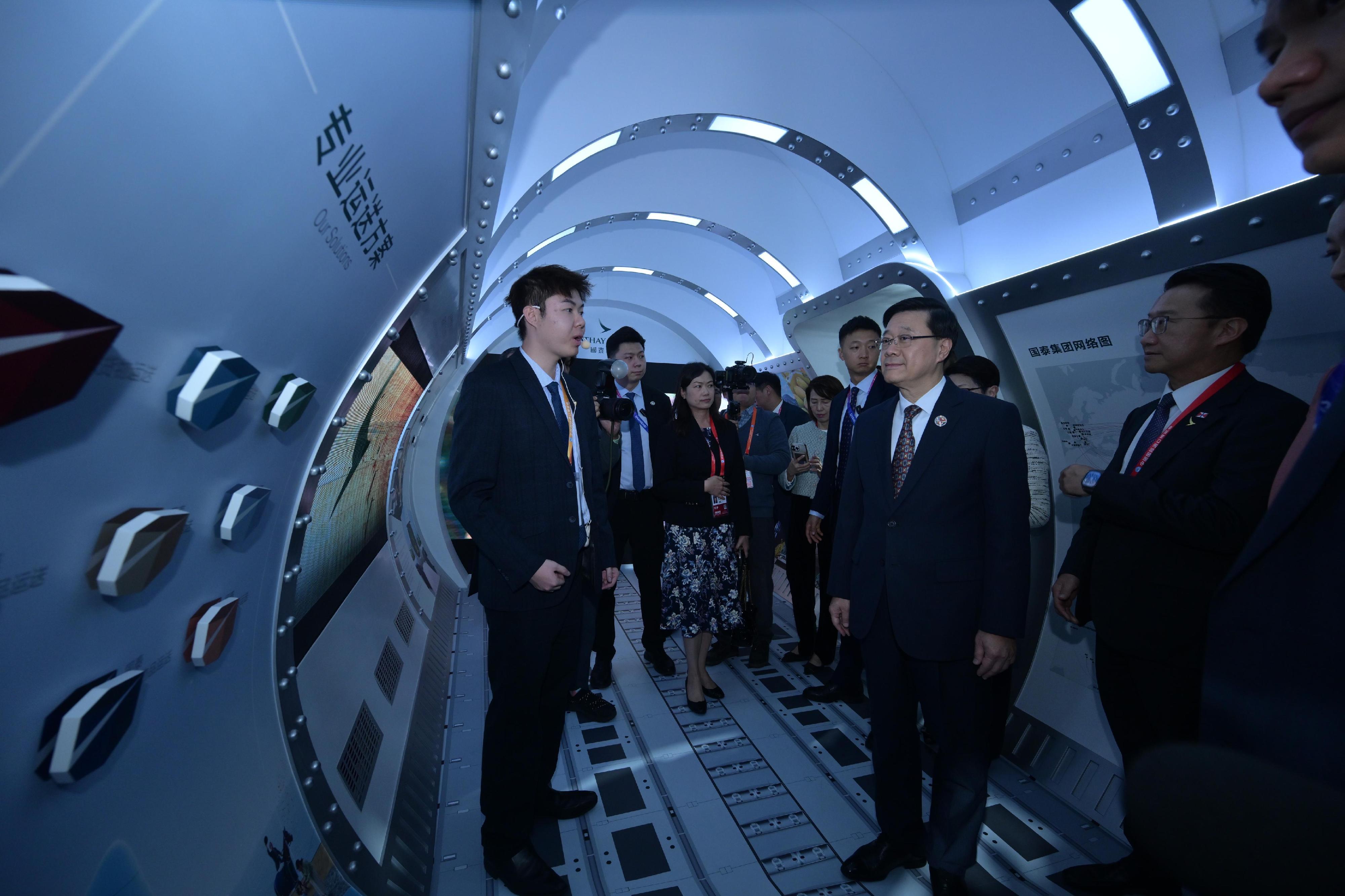 The Chief Executive, Mr John Lee, toured the eighth China International Import Expo in Shanghai today (November 5). Photo shows Mr Lee (second right) visiting the Hong Kong Service Pavilion and interacting with exhibitors.
