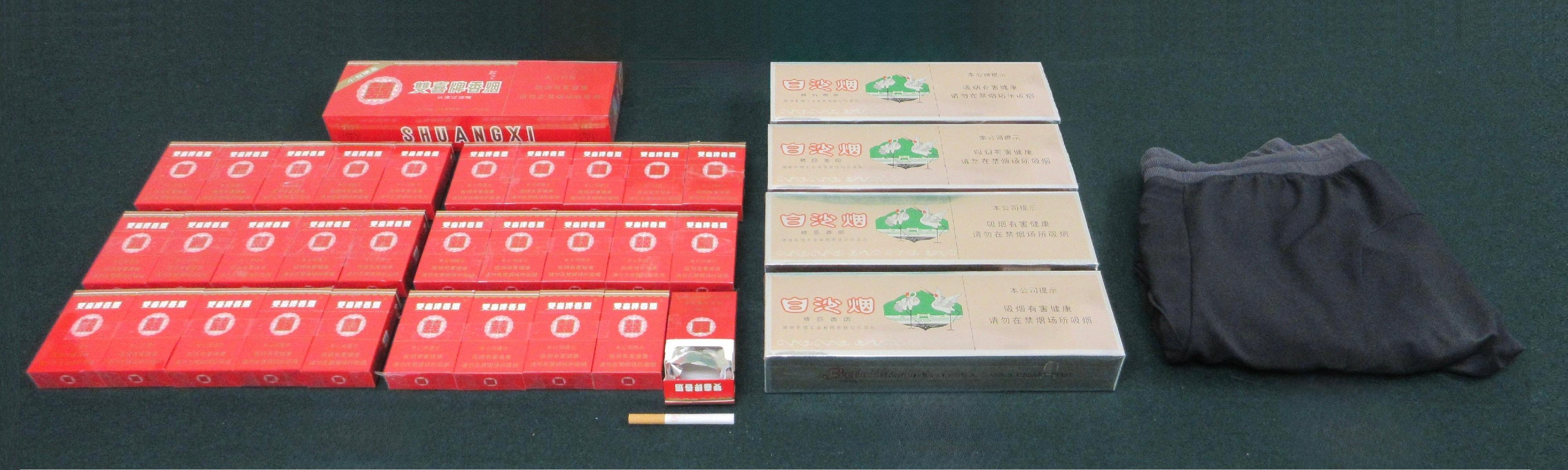 An incoming passenger was sentenced to five weeks' imprisonment and fined $2,000 by the Fanling Magistrates' Courts today (November 6) for possessing duty-not-paid cigarettes and failing to declare them to Customs officers, in contravention of the Dutiable Commodities Ordinance. Photo shows the duty-not-paid cigarettes seized.