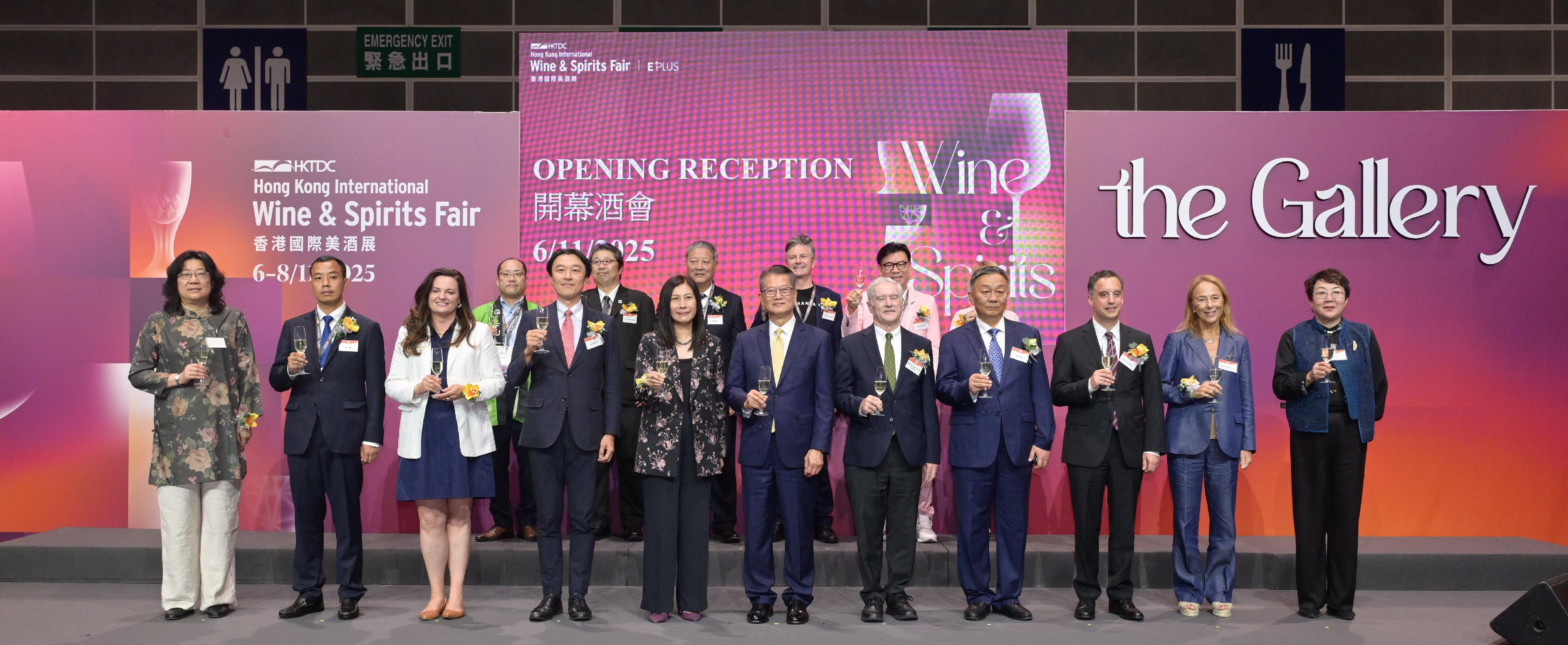 The Financial Secretary, Mr Paul Chan, attended at the Hong Kong International Wine and Spirits Fair 2025 today (November 6). Photo shows Mr Chan (front row, centre); the Acting Executive Director of the Hong Kong Trade Development Council, Ms Jenny Koo (front row, fifth left), and other guests proposing a toast at the event.