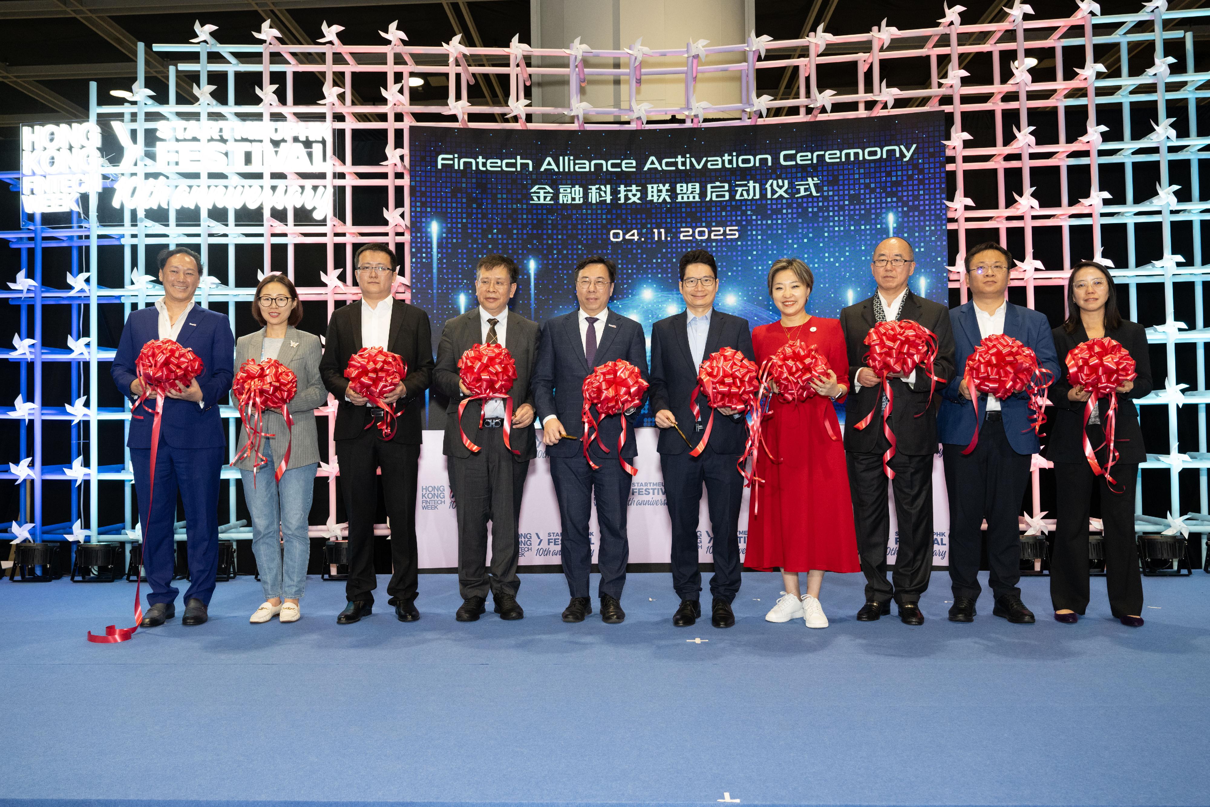 Invest Hong Kong (InvestHK) announced today (November 7), the activation of the Fintech Alliance during the Hong Kong FinTech Week x StartmeupHK Festival 2025, in partnership with the Financial Services and the Treasury Bureau, the FinTech Association of Hong Kong (FTAHK), and leading institutions from Beijing, Shanghai and Shenzhen. Photo shows the Under Secretary for Financial Services and the Treasury, Mr Joseph Chan (fifth right); Associate Director-General of Investment Promotion of InvestHK Mr Arnold Lau (fifth left); the Global Head of Financial Services, Fintech & Sustainability of InvestHK, Mr King Leung (first left); and the Chair of the FTAHK, Ms Lareina Wang (fourth right), with other guests at the activation ceremony.