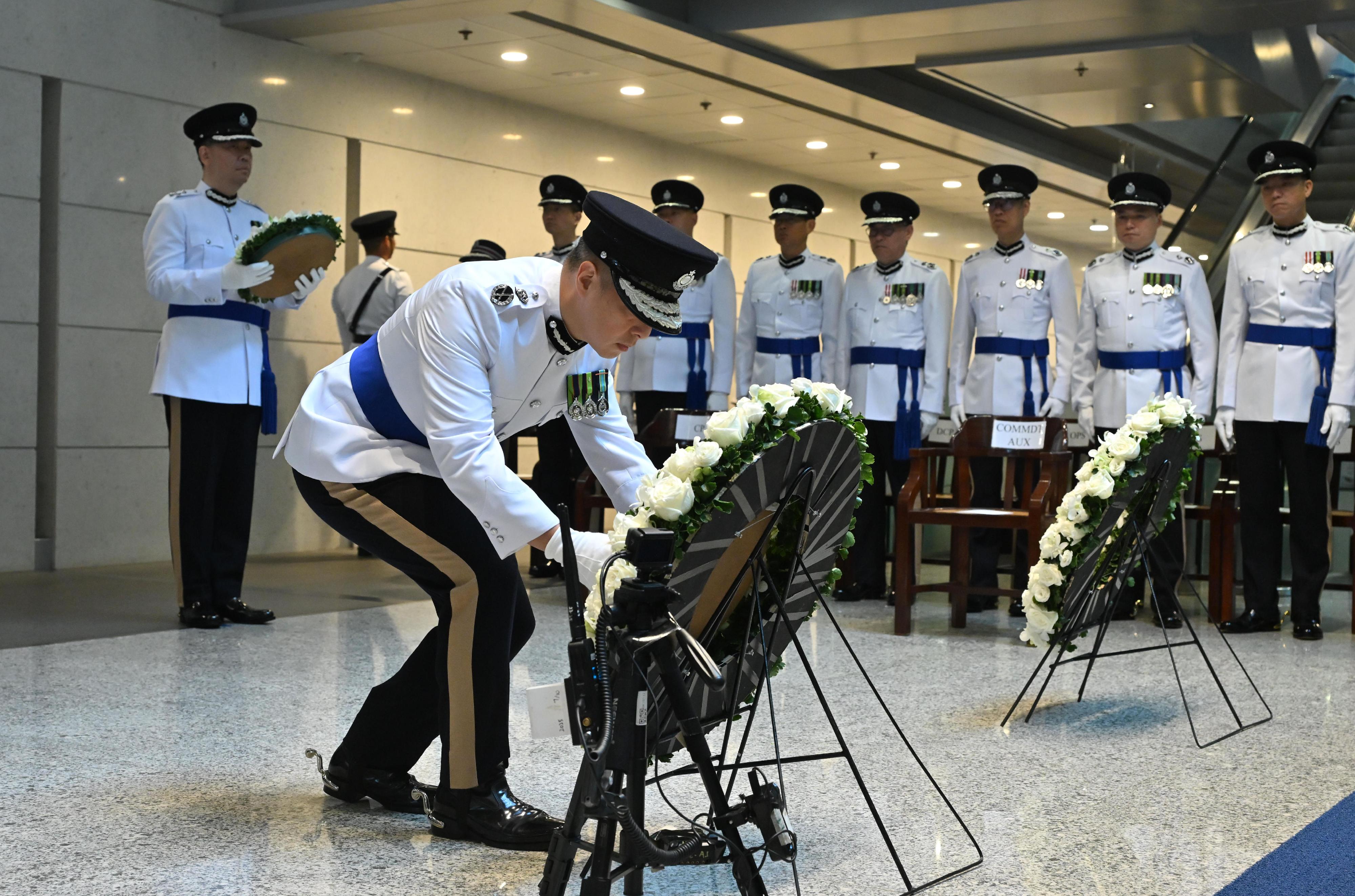The Hong Kong Police Force held the Force Remembrance Day ceremony at the Police Headquarters this morning (November 7) to pay tribute to members of the Hong Kong Police Force and the Hong Kong Auxiliary Police Force who sacrificed their lives in the line of duty. The Commissioner of Police, Mr Chow Yat-ming, lays a wreath in front of the Force Memorial Wall on which the names of the fallen are inscribed.