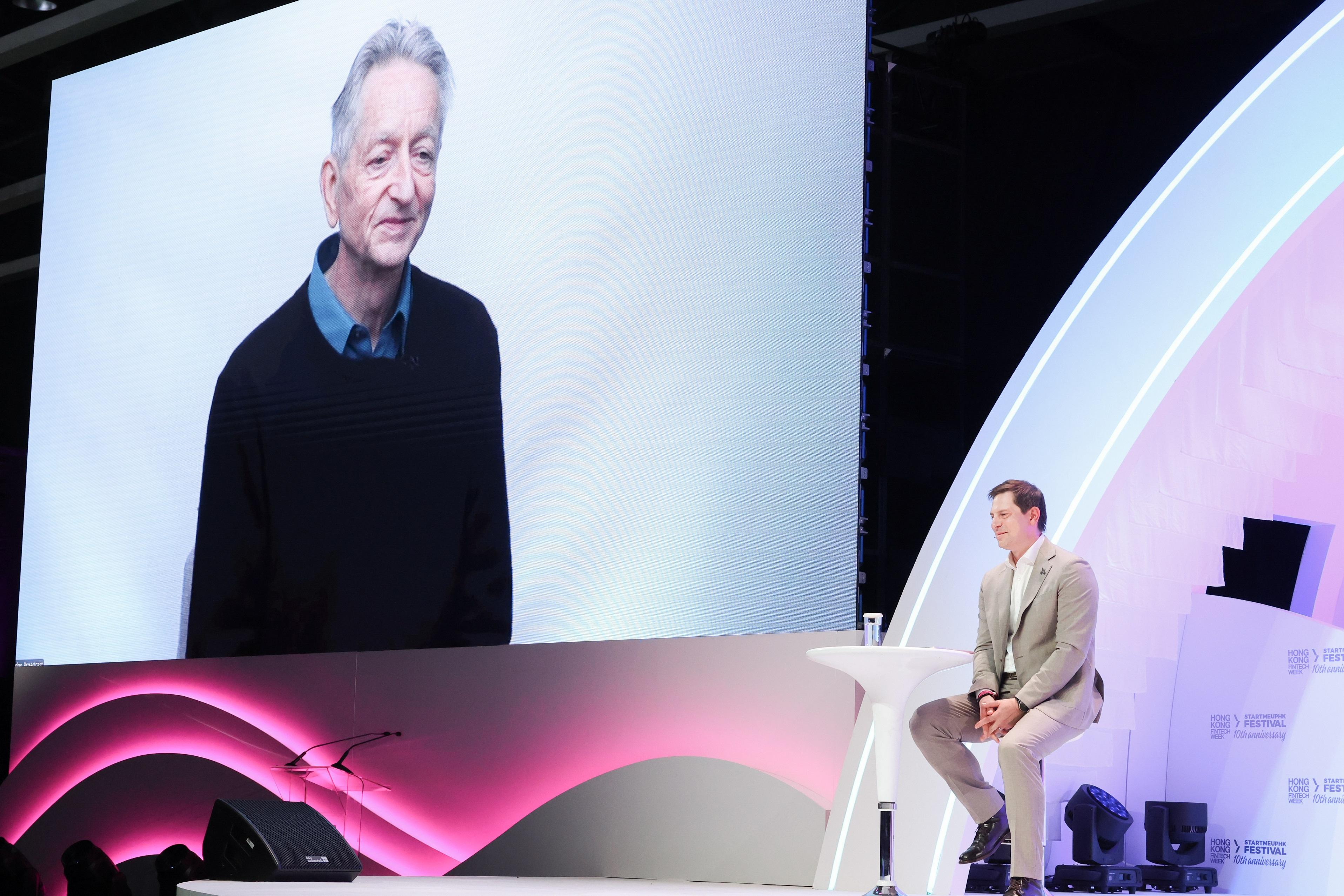 The Hong Kong FinTech Week x StartmeupHK Festival (HKFW x SMUF) 2025 concluded today (November 7). Photo shows Nobel Laureate in Physics, Professor Emeritus of the University of Toronto Mr Geoffrey Hinton sharing views via video conferencing at the HKFW x SMUF 2025 on November 3.