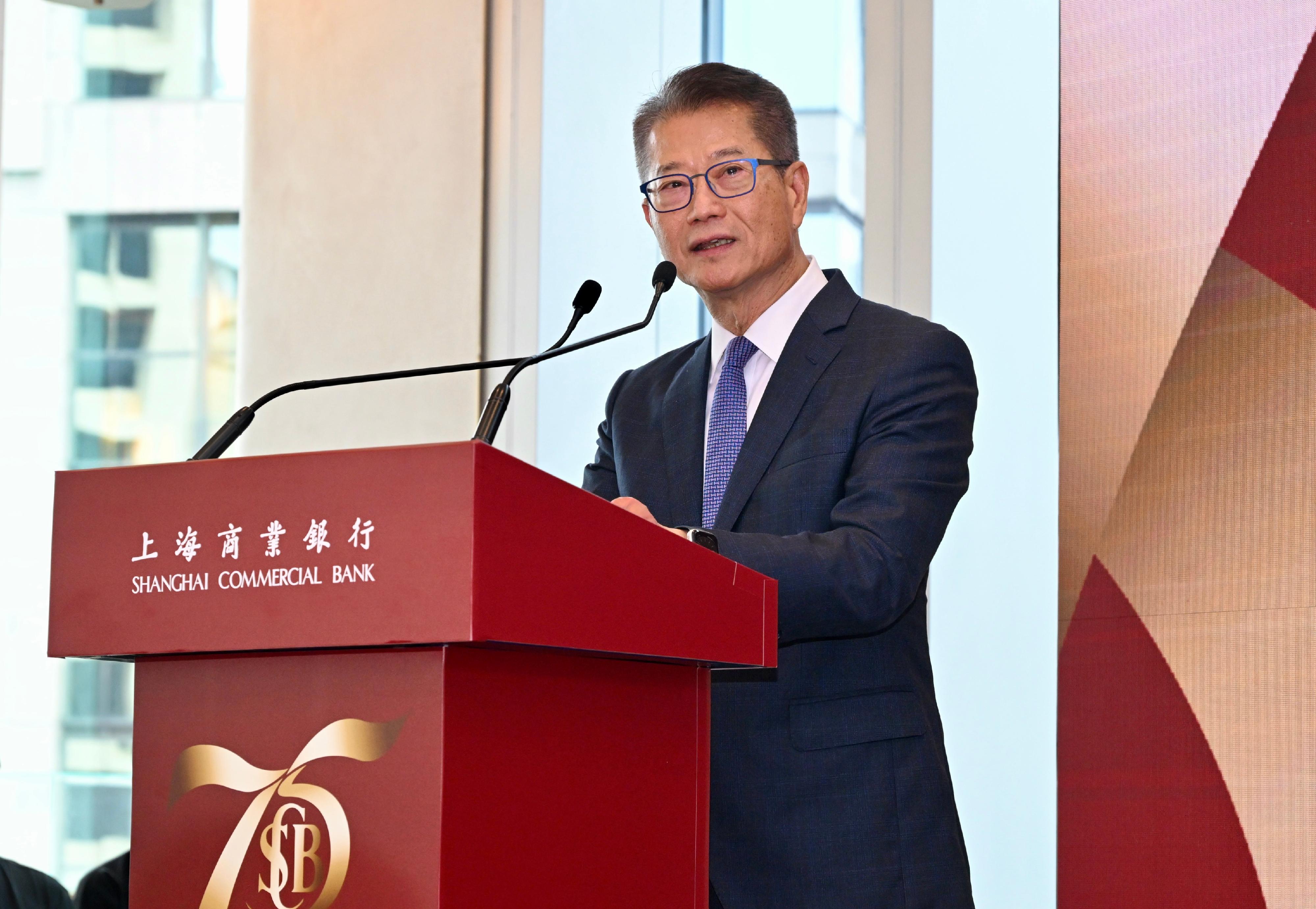The Financial Secretary, Mr Paul Chan, speaks at the kick-off ceremony of the Shanghai Commercial Bank's 75th anniversary celebration today (November 7).