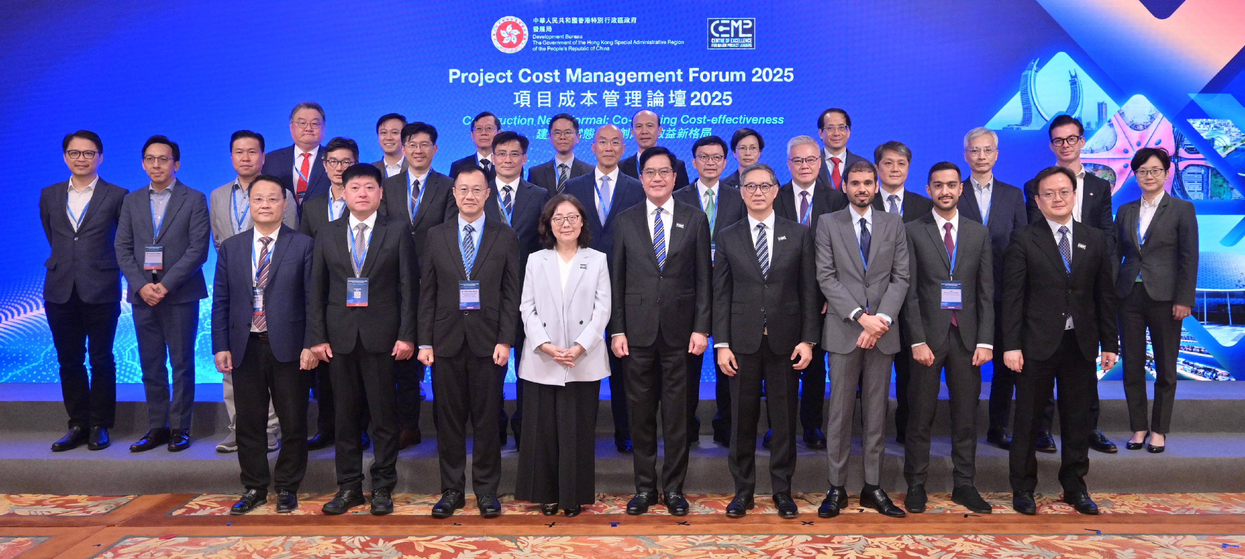 The Development Bureau (DEVB) held the Project Cost Management Forum 2025 today (November 7). With the theme “Construction New Normal: Co-defining Cost-effectiveness”, the forum explored how to enhance the cost management and cost-effectiveness of construction projects through optimised procurement strategies and the application of innovative technologies. Photo shows the Deputy Financial Secretary, Mr Michael Wong (front row, centre); the Secretary for Development, Ms Bernadette Linn (front row, fourth left); the Permanent Secretary for Development (Works), Mr Ricky Lau (front row, fourth right); and the Head of the Project Strategy and Governance Office of the Development Bureau, Mr Joseph Lo (front row, first right), with other guests.