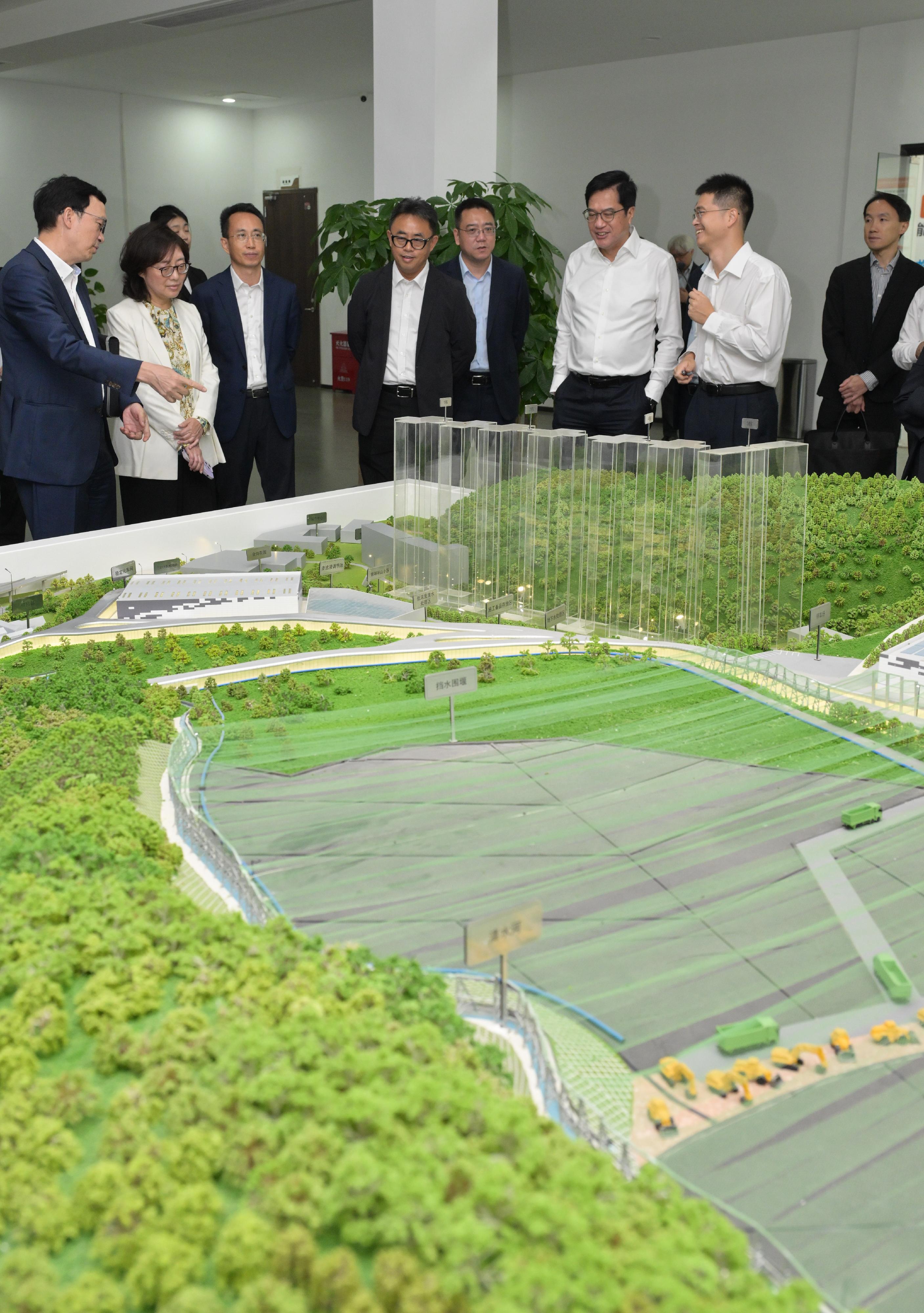 The Deputy Financial Secretary, Mr Michael Wong, and Vice Mayor of the Shenzhen Municipal People's Government Mr Tao Yongxin, leading delegations of the governments of the Hong Kong Special Administrative Region (HKSAR) and Shenzhen respectively, held a meeting of the Task Force for Collaboration on the Northern Metropolis Development Strategy in Shenzhen today (November 12). Photo shows Mr Wong (second right) and the HKSAR delegation visiting the Yulong Landfill Remediation Project in Luohu District to learn more about Shenzhen's efforts and achievements in safeguarding people's livelihood and ecological governance. Looking on are the Secretary for Development, Ms Bernadette Linn (second left), and the Under Secretary for Transport and Logistics, Mr Liu Chun-san (first left).