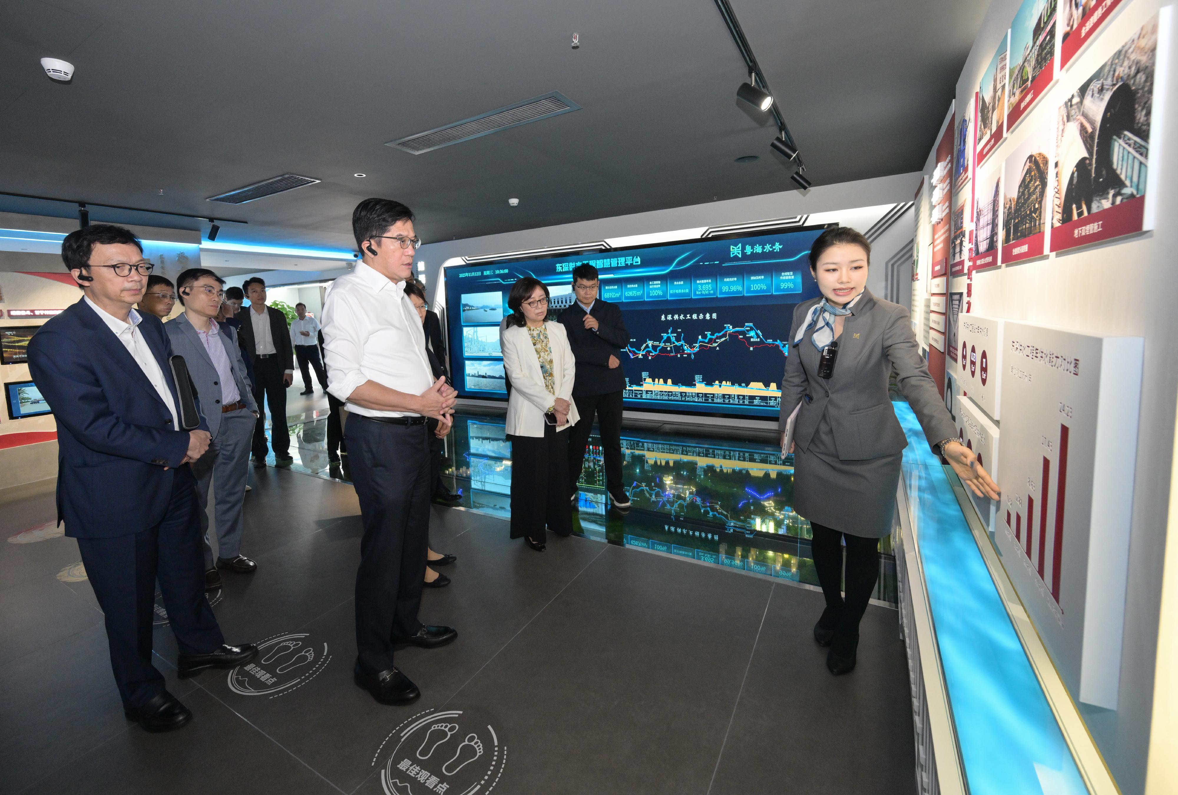 The Deputy Financial Secretary, Mr Michael Wong, and Vice Mayor of the Shenzhen Municipal People's Government Mr Tao Yongxin, leading delegations of the governments of the Hong Kong Special Administrative Region (HKSAR) and Shenzhen respectively, held a meeting of the Task Force for Collaboration on the Northern Metropolis Development Strategy in Shenzhen today (November 12). Photo shows Mr Wong (second left) and the HKSAR delegation visiting the exhibition hall of Guangdong Yuehai Water Co Ltd, reviewing the 60-year history and development of Dongjiang water supply to Hong Kong. Looking on are the Secretary for Development, Ms Bernadette Linn (second right), and the Under Secretary for Transport and Logistics, Mr Liu Chun-san (first left).