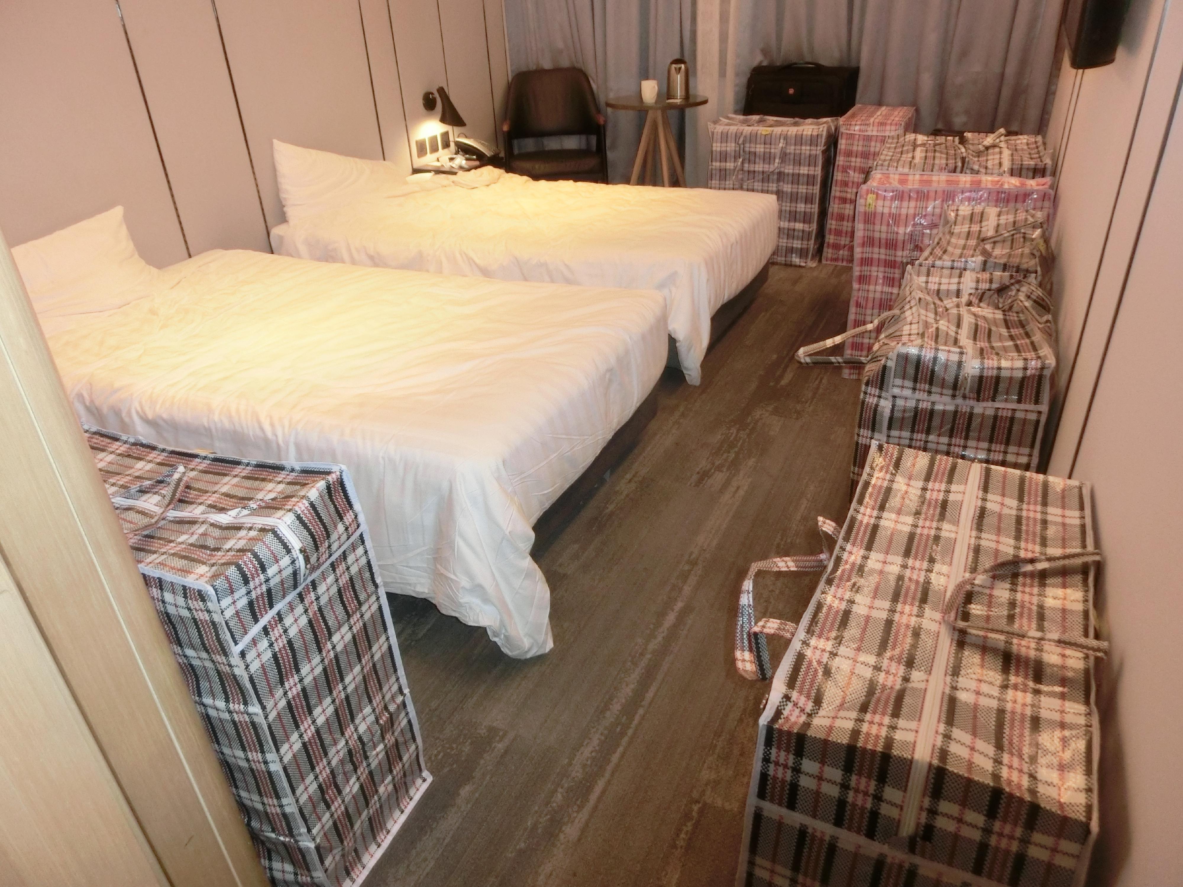 Hong Kong Customs yesterday (November 12) raided a suspected illicit cigarette storage centre in Kwai Chung and seized about 240 000 suspected illicit cigarettes with an estimated market value of about $1.08 million and a duty potential of about $790,000. Five persons suspected to be connected with the case were arrested. Photo shows some of the suspected illicit cigarettes seized in a hotel room involved in the case.