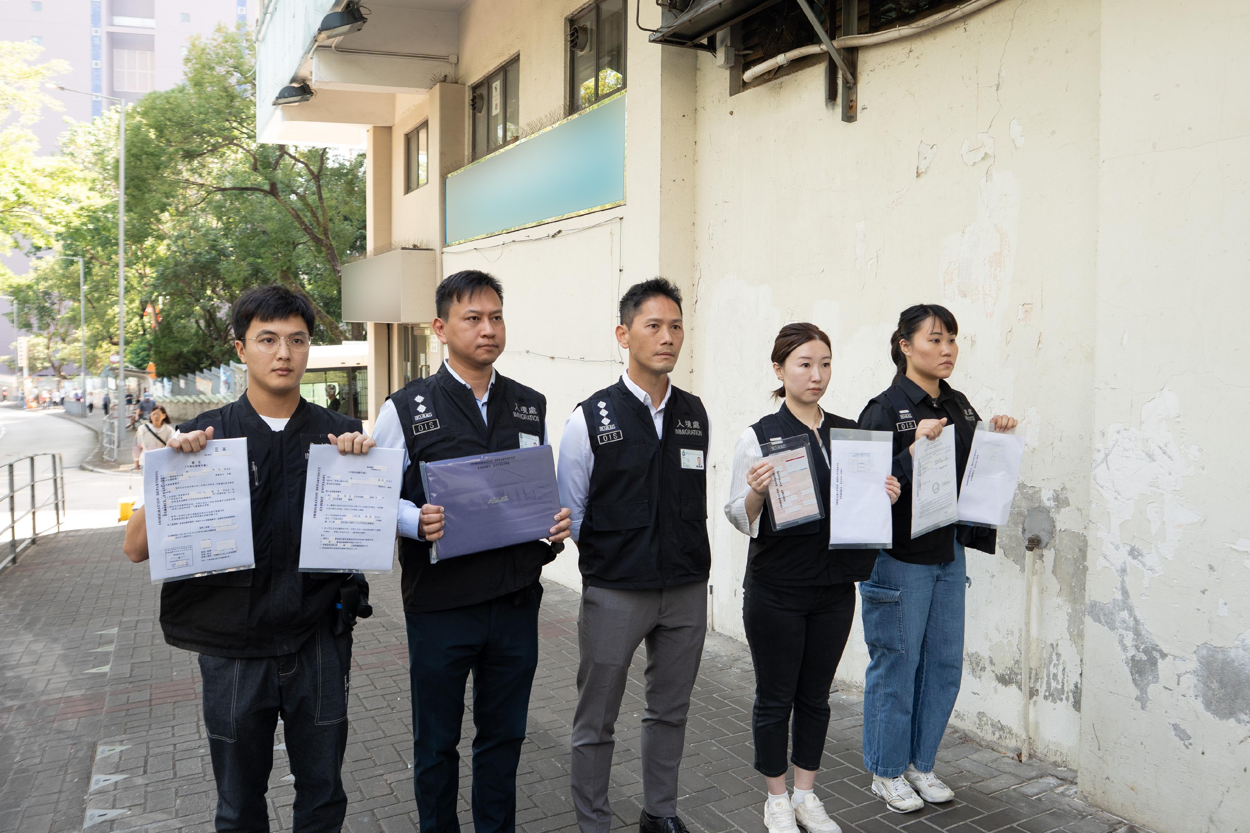 The Immigration Department smashed a bogus marriage syndicate today (November 17). Investigators show part of the documentations and computer equipment seized during the raid.