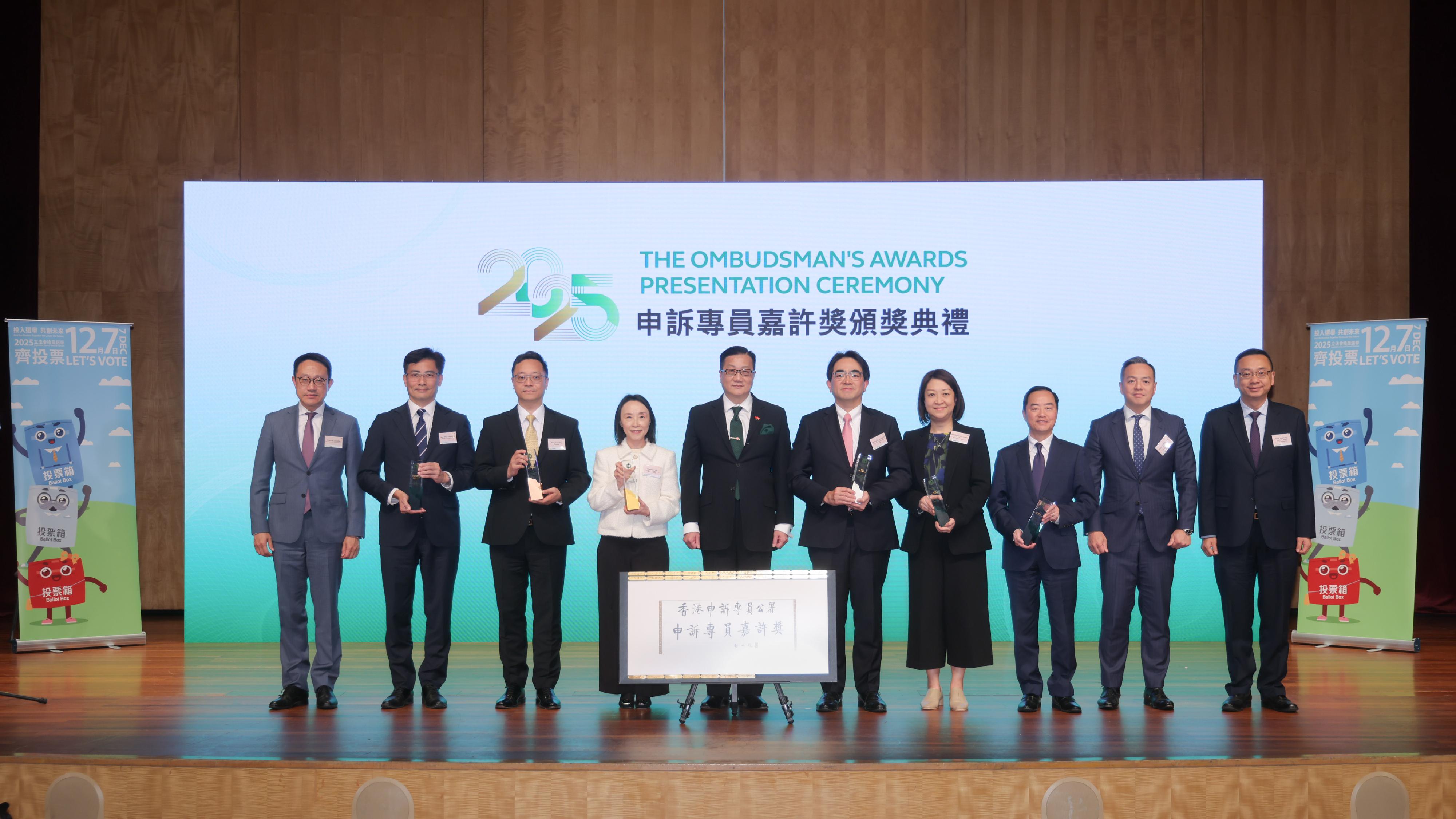 The Office of The Ombudsman held the 28th Presentation Ceremony of The Ombudsman's Awards today (November 18). Photo shows (from left) the Commissioner of Customs and Excise, Mr Chan Tsz-tat; the Director of Drainage Services, Mr Mok Wing-cheong; the Commissioner of Correctional Services, Mr Wong Kwok-hing; the Director of Housing, Miss Charmaine Lee; the Ombudsman, Mr Jack Chan; the Director of Food and Environmental Hygiene, Mr Donald Ng; the Commissioner for Transport, Ms Angela Lee; the Commissioner for Digital Policy, Mr Tony Wong; the Commissioner of Police, Mr Chow Yat-ming; and the Director of Immigration, Mr Benson Kwok at the presentation ceremony.