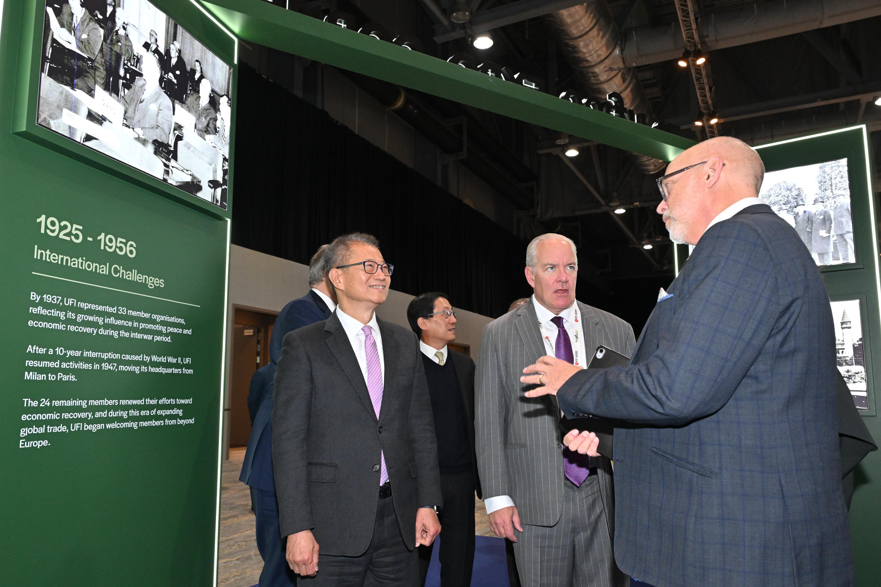 The Financial Secretary, Mr Paul Chan, attended the UFI Global Congress 2025 today (November 20). Photo shows Mr Chan (first left) visiting an exhibition booth.