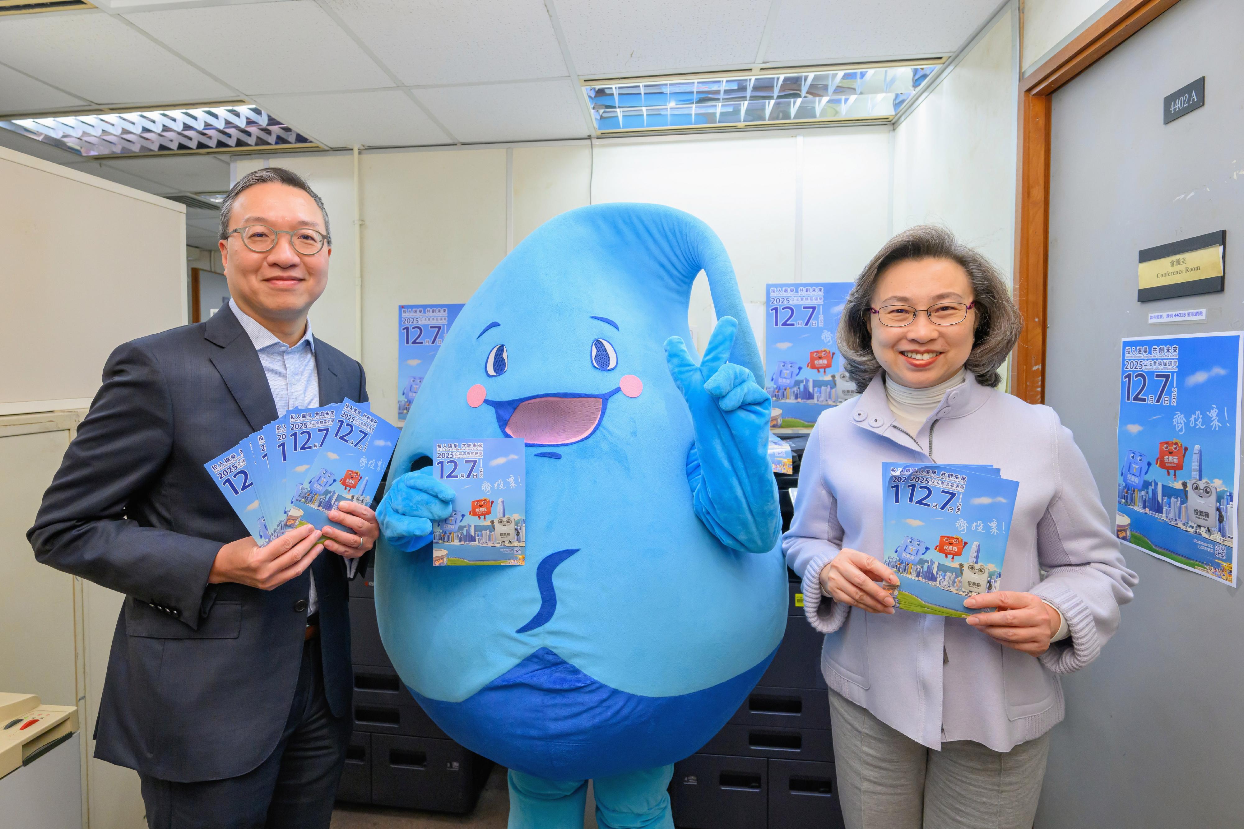 The Financial Secretary, Mr Paul Chan; the Secretary for Justice, Mr Paul Lam, SC; and the Secretary for the Civil Service, Mrs Ingrid Yeung, visited government offices in Wan Chai today (November 20) to promote and call on civil servants to vote together in the Legislative Council (LegCo) Election on December 7. Photo shows Mr Lam (left) and Mrs Yeung (right) with the mascot of the Water Services Department (WSD), named Water Save Dave, at the workplace of the WSD.