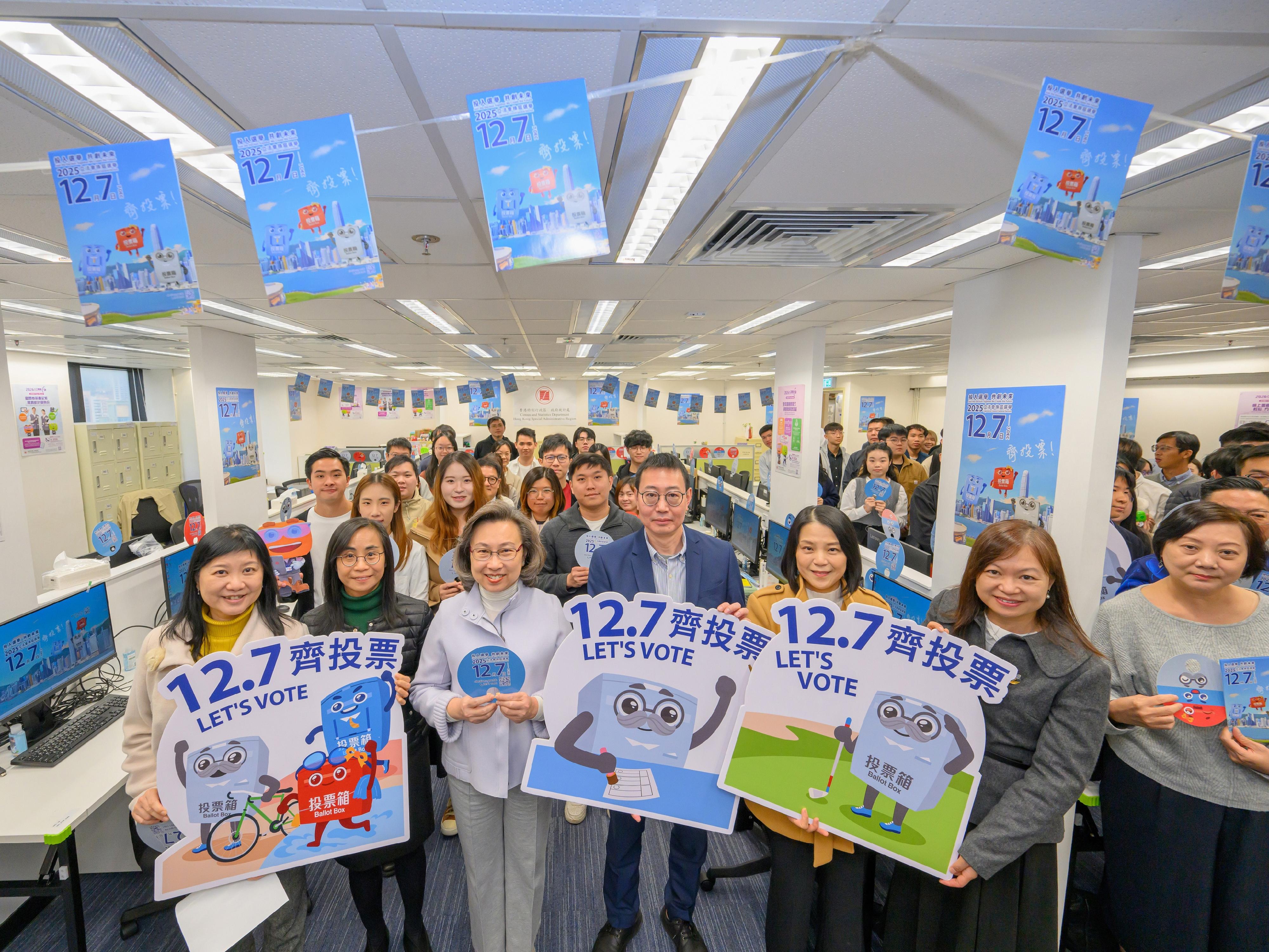 The Financial Secretary, Mr Paul Chan; the Secretary for Justice, Mr Paul Lam, SC; and the Secretary for the Civil Service, Mrs Ingrid Yeung, visited government offices in Wan Chai today (November 20) to promote and call on civil servants to vote together in the Legislative Council (LegCo) Election on December 7. Photo shows Mrs Yeung (first row, third left) and the Acting Commissioner for Census and Statistics, Mr Tim Chau (first row, fourth left), with colleagues of the Census and Statistics Department (C&SD) at the workplace of the C&SD.