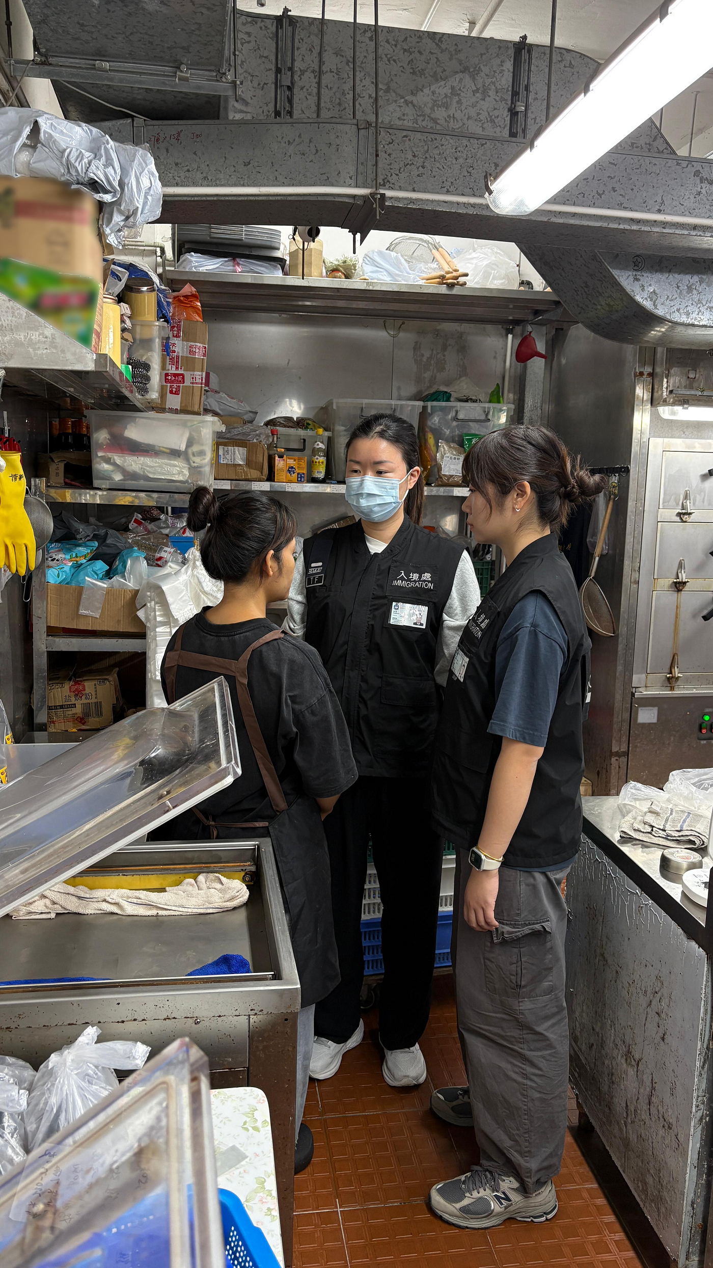 The Immigration Department mounted a series of territory-wide anti-illegal worker operations codenamed "Blockade" and "Twilight", a joint operation with the Labour Department codenamed "Rainbow" and joint operations with the Hong Kong Police Force codenamed "Champion" from November 14 to yesterday (November 20). Photo shows a suspected illegal worker arrested during an operation.