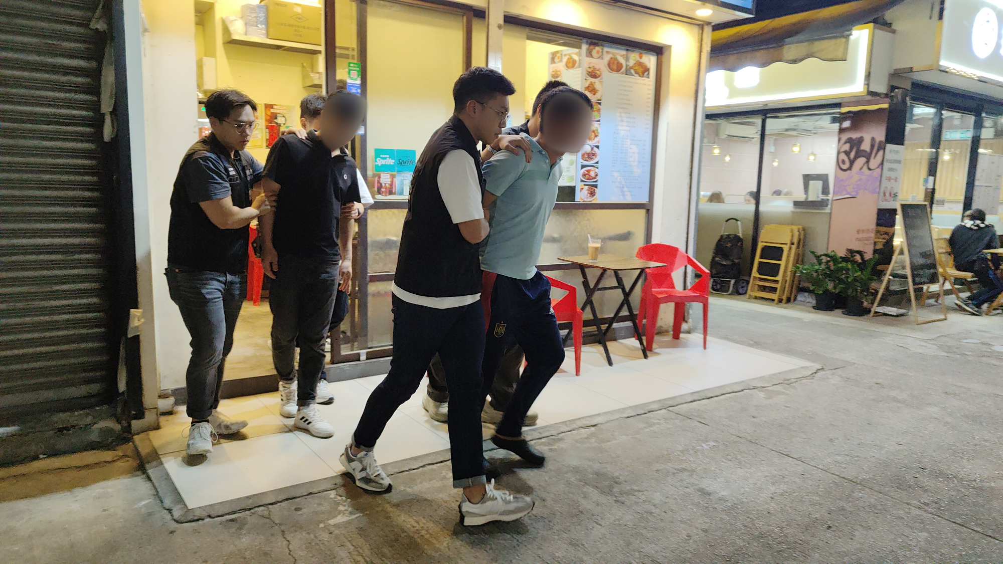 The Immigration Department mounted a series of territory-wide anti-illegal worker operations codenamed "Blockade" and "Twilight", a joint operation with the Labour Department codenamed "Rainbow" and joint operations with the Hong Kong Police Force codenamed "Champion" from November 14 to yesterday (November 20). Photo shows suspected illegal workers arrested during an operation.

