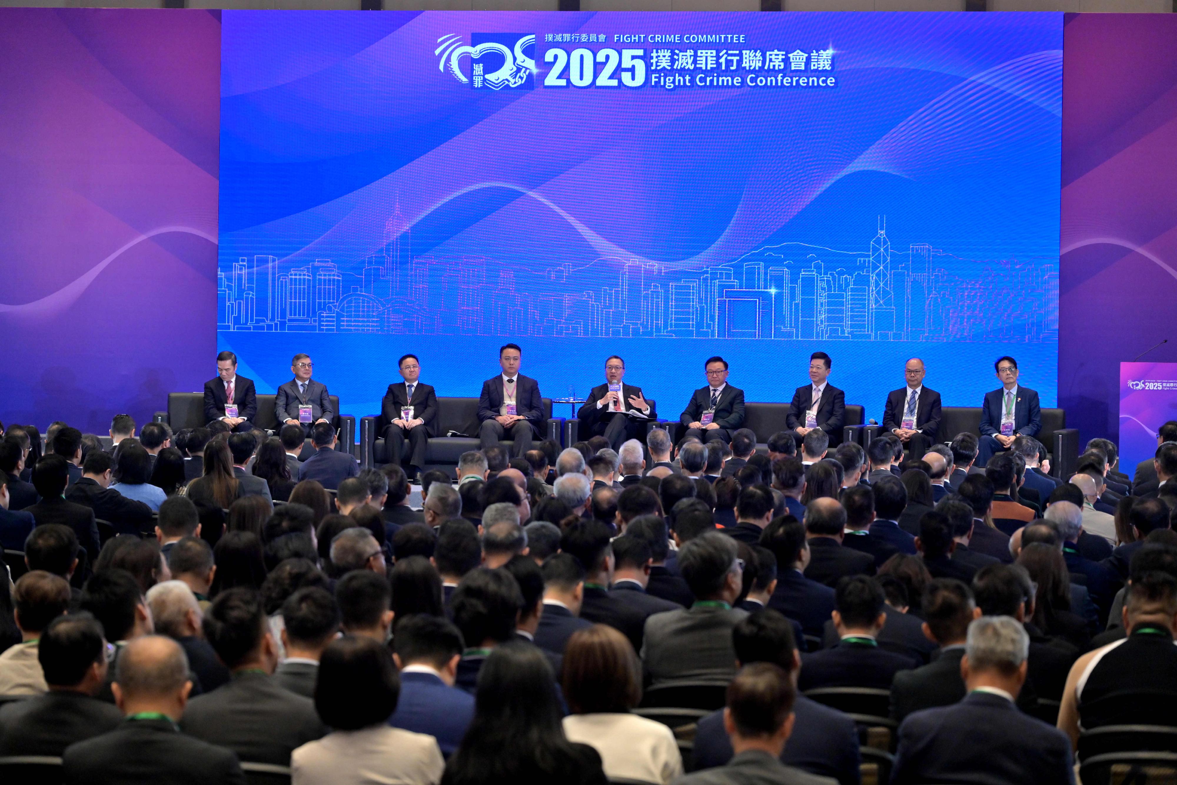The Fight Crime Committee (FCC) today (November 22) held the 2025 Fight Crime Conference at the Central Government Offices with nearly 400 participants exchanging views on topics relating to law and order and crime-fighting strategies in Hong Kong. Photo shows the Secretary for Justice, Mr Paul Lam, SC (centre), leading the plenary session on national security education in the community, and inviting members of the FCC and the District Fight Crime Committees to share their experiences.