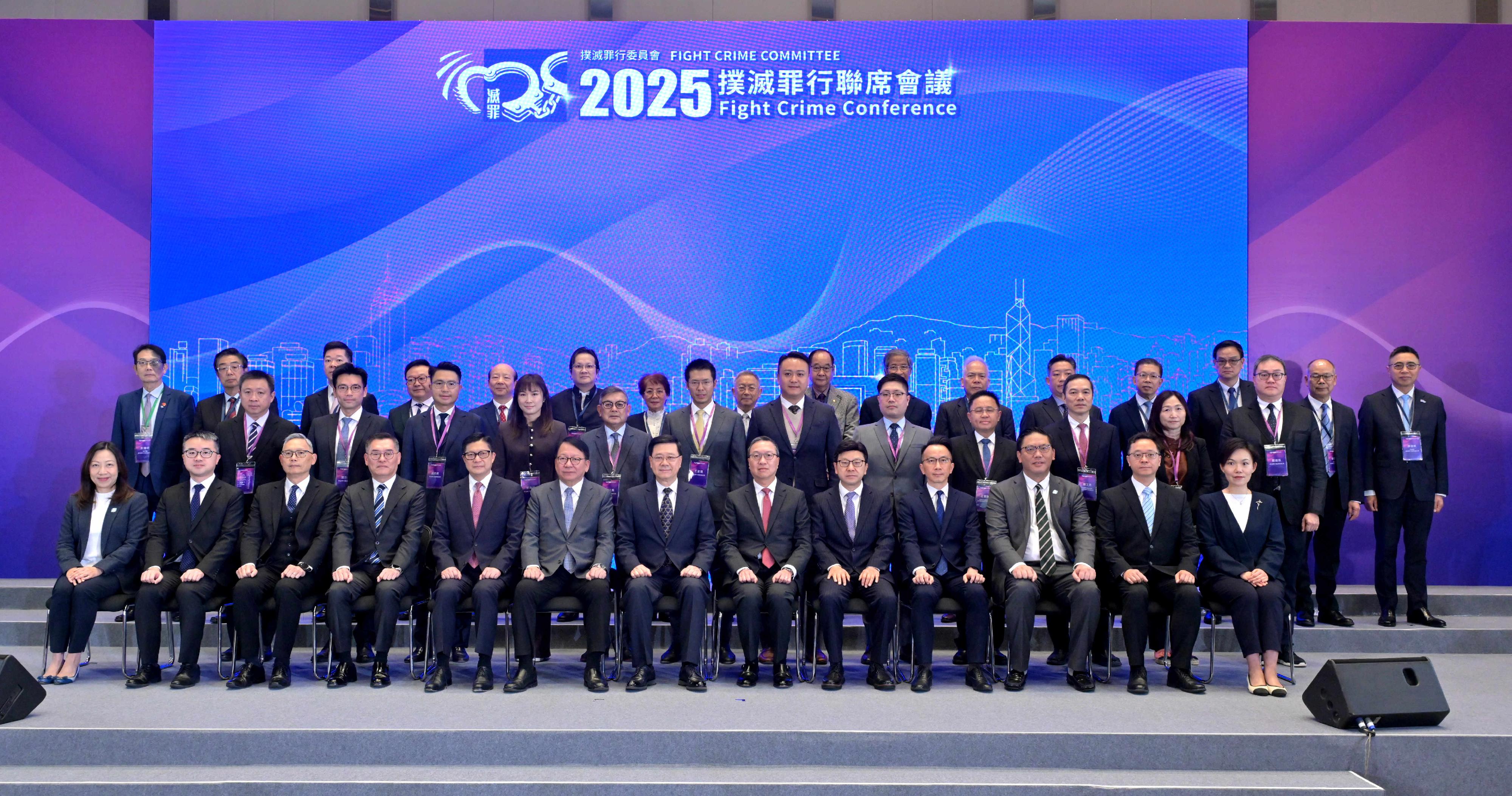 The Fight Crime Committee (FCC) today (November 22) held the 2025 Fight Crime Conference at the Central Government Offices with nearly 400 participants exchanging views on topics relating to law and order and crime-fighting strategies in Hong Kong. Photo shows (front row, from left) the Director of Home Affairs, Ms Priscilla To; the Under Secretary for Education, Dr Sze Chun-fai; the Under Secretary for Security, Mr Michael Cheuk; the Acting Commissioner of Police, Mr Kan Kai-yan; the Secretary for Security, Mr Tang Ping-keung; the Chief Secretary for Administration and the Chairperson of the FCC, Mr Chan Kwok-ki; the Chief Executive, Mr John Lee; the Secretary for Justice, Mr Paul Lam, SC; the Secretary for Labour and Welfare, Mr Chris Sun; the Permanent Secretary for Security, Mr Patrick Li; the Under Secretary for Home and Youth Affairs, Mr Clarence Leung; the Commissioner of Correctional Services, Mr Wong Kwok-hing and Secretary of Fight Crime Committee, Miss Vinci Chan, with members of the FCC and the District Fight Crime Committees.
