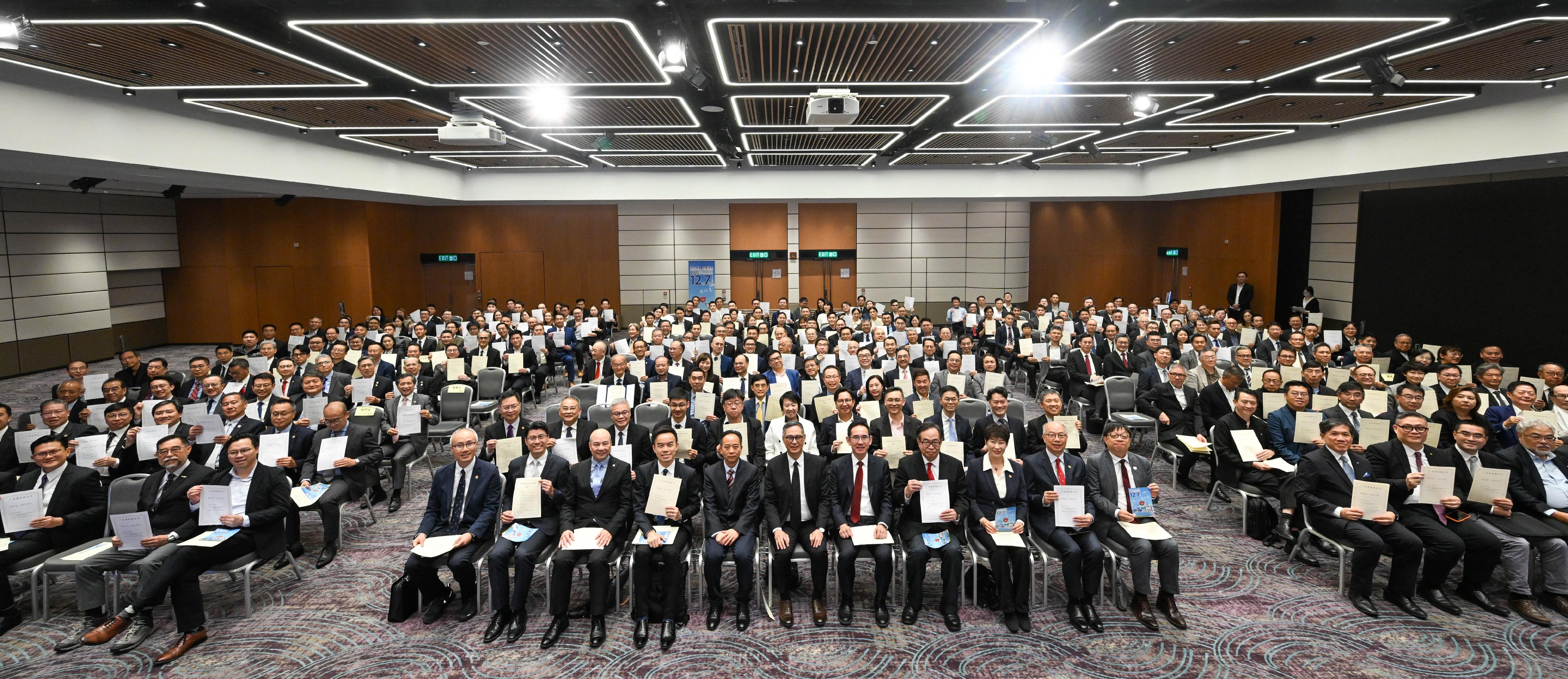 The Permanent Secretary for Development (Works), Mr Ricky Lau, today (November 24) attended a celebration ceremony jointly organised by the Hong Kong Institute of Architects (HKIA), the Hong Kong Institution of Engineers (HKIE) and the Hong Kong Institute of Surveyors (HKIS). About 300 local construction and engineering professionals who obtained the corresponding engineering professional qualifications in the Mainland joined the ceremony. Photo shows (from first row, sixth left) the President of HKIS, Mr Robin Leung; Vice President of HKIA, Mr Allen Poon; the Deputy Director-General of the Department of Educational, Scientific and Technological Affairs of the Liaison Office of the Central People's Government in the Hong Kong Special Administrative Region, Mr Ye Shuiqiu; Mr Lau; the Under Secretary for Development, Mr David Lam; the Legislative Council member (Engineering Functional Constituency), Dr Lo Wai-kwok; the President of the HKIE, Ms Alice Chow, with other guests and attending local construction and engineering professionals.