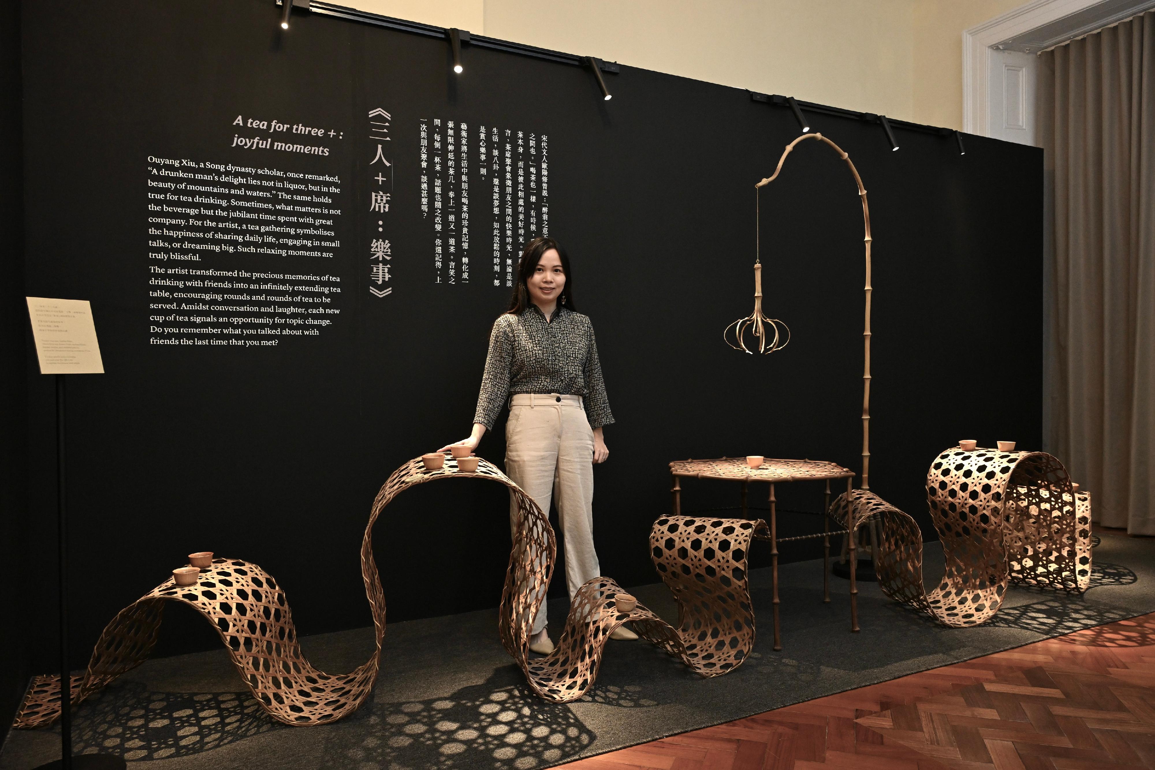 The Flagstaff House Museum of Tea Ware will stage the "Hong Kong Artist Dialogue Series: Shape of Tea" exhibition starting from tomorrow (November 26), featuring 35 sets of tea ware from the museum's collections, along with 20 sets of new works created by wood artist Yan Yung and bamboo artist Inkgo Lam. Photo shows Lam and her work "A tea for three +: joyful moments".