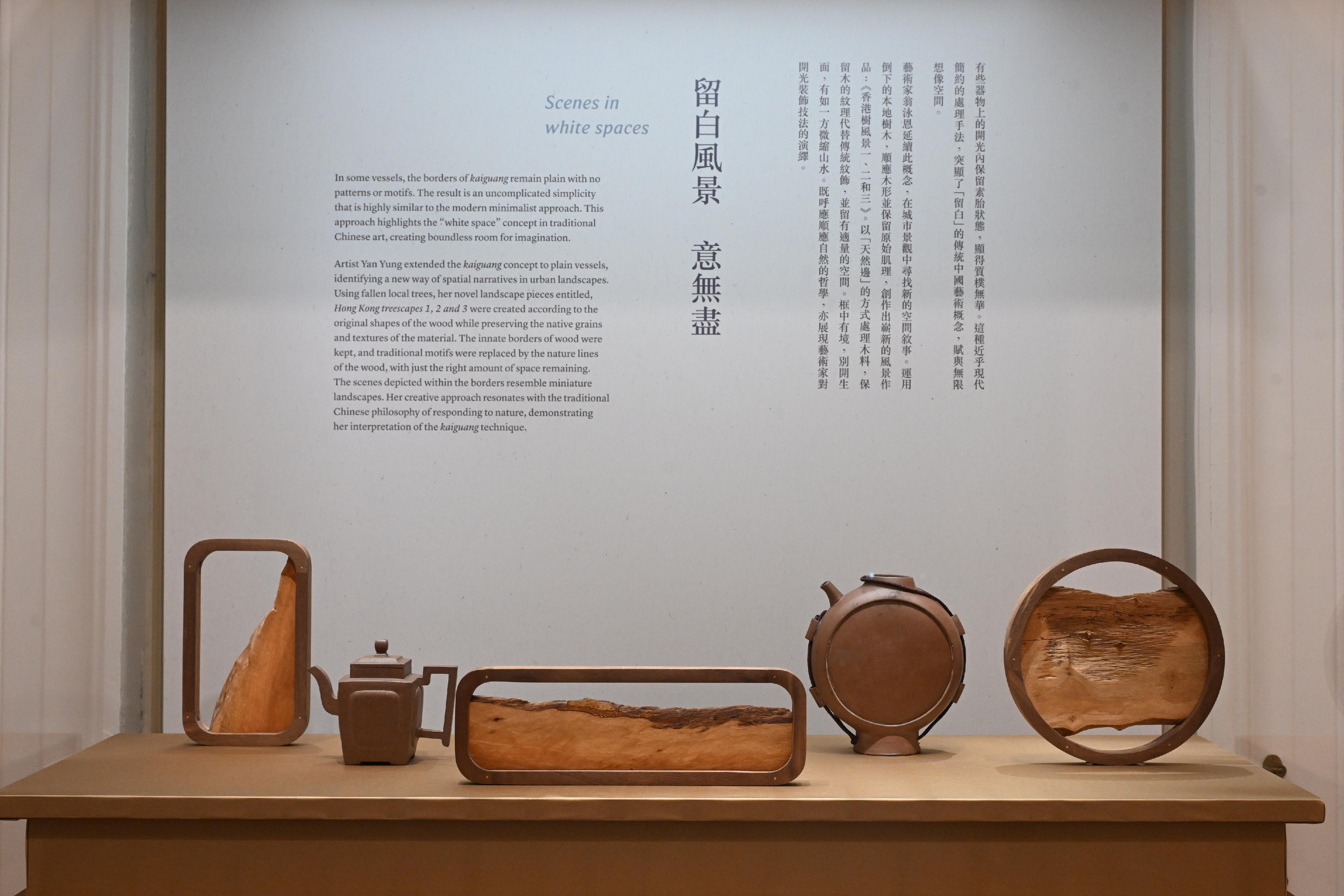 The Flagstaff House Museum of Tea Ware will stage the "Hong Kong Artist Dialogue Series: Shape of Tea" exhibition starting from tomorrow (November 26), featuring 35 sets of tea ware from the museum's collections, along with 20 sets of new works created by wood artist Yan Yung and bamboo artist Inkgo Lam. Photo shows tea ware from the museum's collections and Yung's "Hong Kong treescapes 1, 2, 3" created from fallen wood.