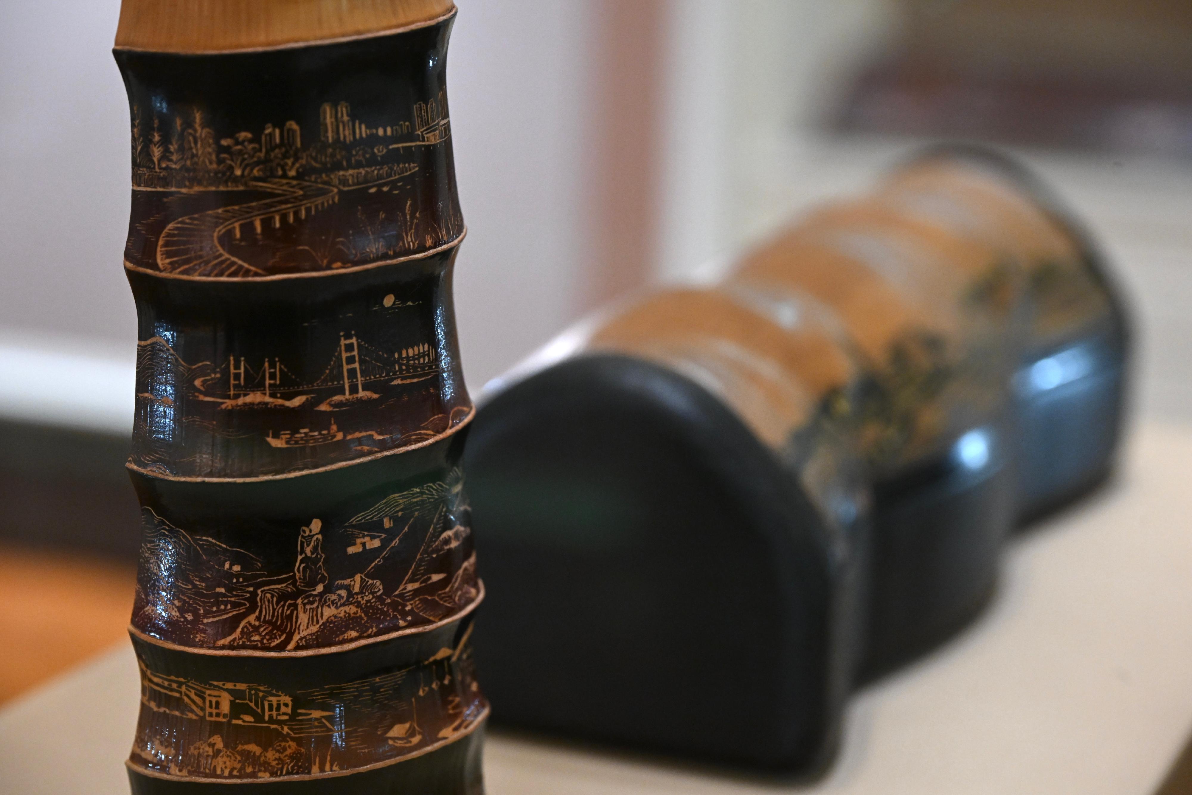 The Flagstaff House Museum of Tea Ware will stage the "Hong Kong Artist Dialogue Series: Shape of Tea" exhibition starting from tomorrow (November 26), featuring 35 sets of tea ware from the museum's collections, along with 20 sets of new works created by wood artist Yan Yung and bamboo artist Inkgo Lam. Photo shows Lam's "Home of many" bamboo joint tea scoop which depicts Hong Kong urban and rural landscapes.