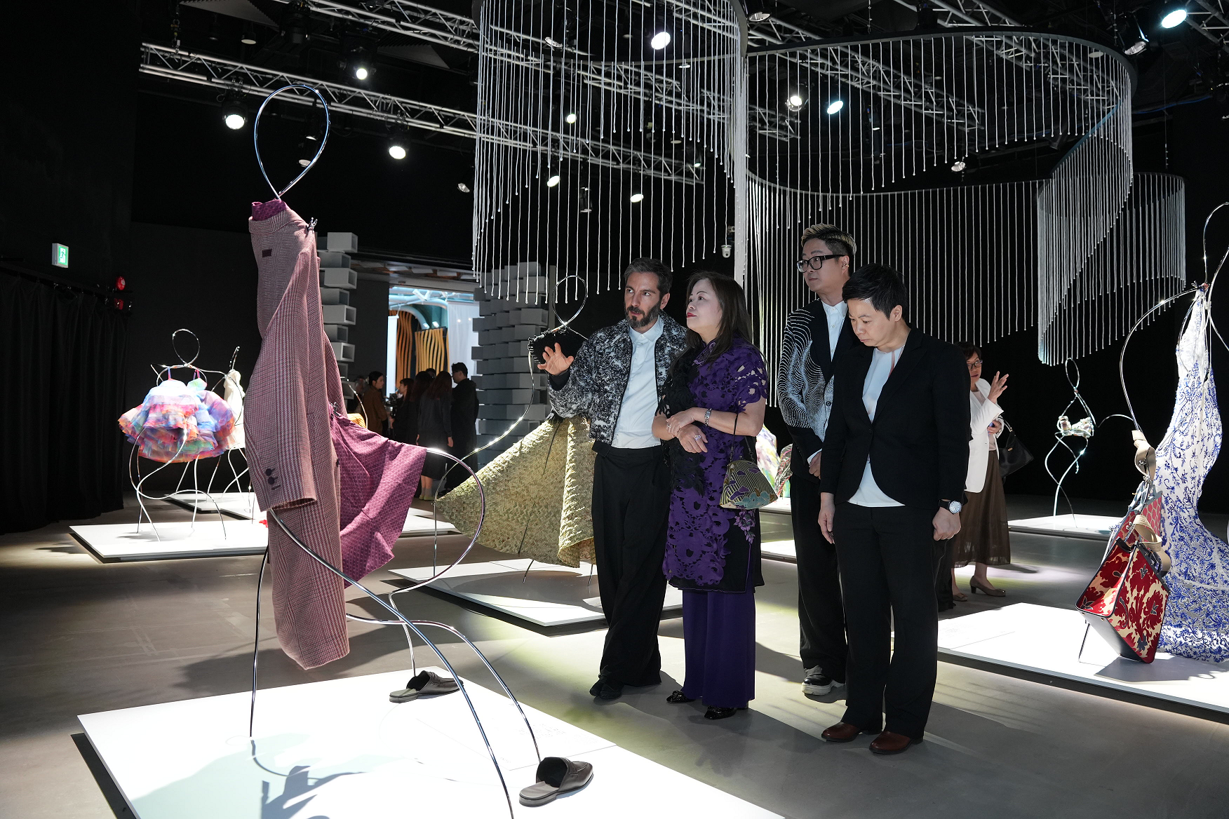 Presented by the Government of the Hong Kong Special Administrative Region, spearheaded and sponsored by the Cultural and Creative Industries Development Agency of the Culture, Sports and Tourism Bureau, the second edition of Hong Kong Fashion Fest today (November 25) presented the flagship programme crossover with Milan Fashion Week "Fashion to Reconnect: A Tale of Two Style Capitals". Photo shows the Secretary for Culture, Sports and Tourism, Miss Rosanna Law (second left), viewing fashion works.