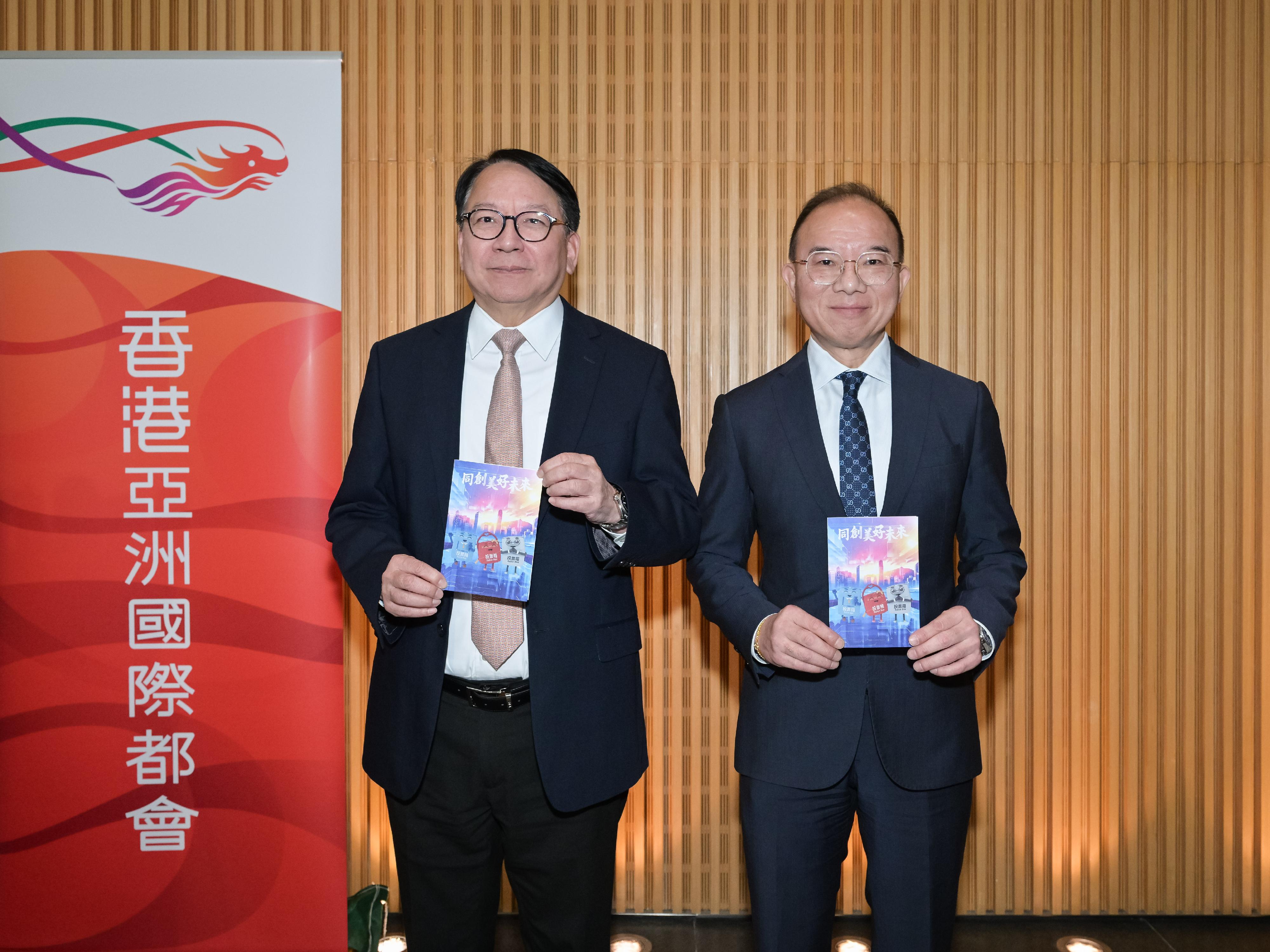 The Chief Secretary for Administration, Mr Chan Kwok-ki (left), accompanied by the Secretary for Constitutional and Mainland Affairs, Mr Erick Tsang Kwok-wai (right), meets the media on the distribution of thank you cards to voters during the 2025 Legislative Council General Election today (November 26).