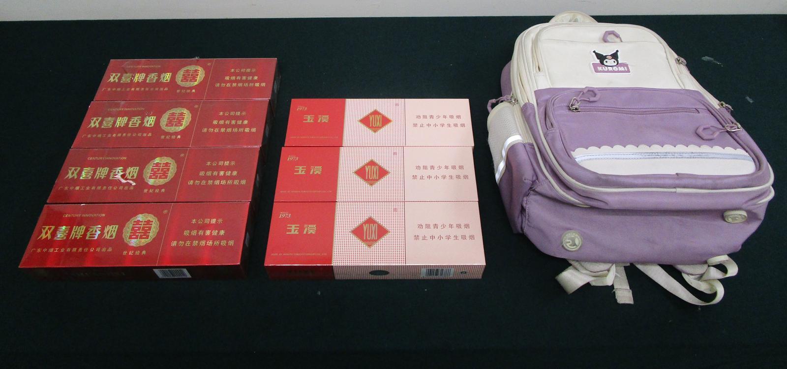 A 32-year-old incoming female passenger was sentenced to eight weeks' imprisonment and fined $2,000 by the Fanling Magistrates' Courts today (November 28) for importing goods to which Dutiable Commodities Ordinance (DCO) applies, in contravention of the DCO. Photo shows the duty-not-paid cigarettes seized and the backpack used to conceal the duty-not-paid cigarettes.