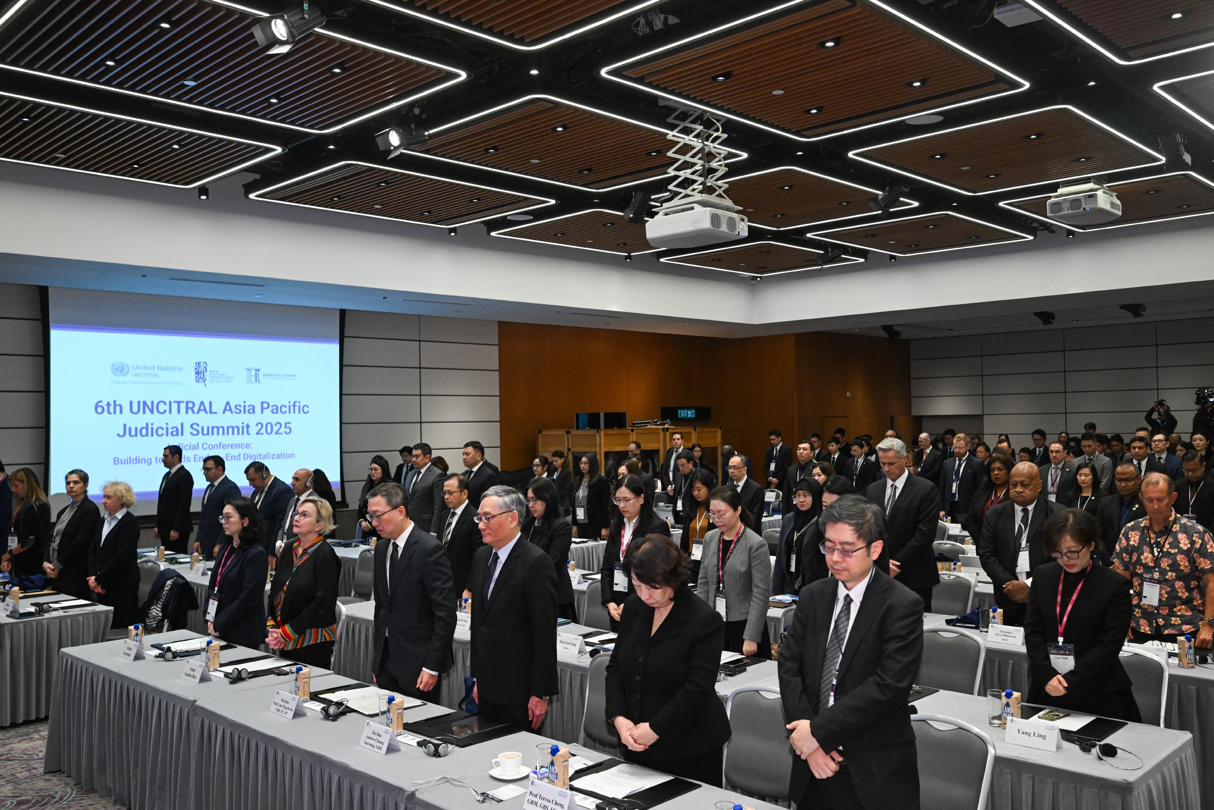The Hong Kong Legal Week 2025 commenced today (December 1). Photo shows all participants standing up and observing a moment of silence to mourn the victims of the Tai Po fire before the start of the Legal Week activities.