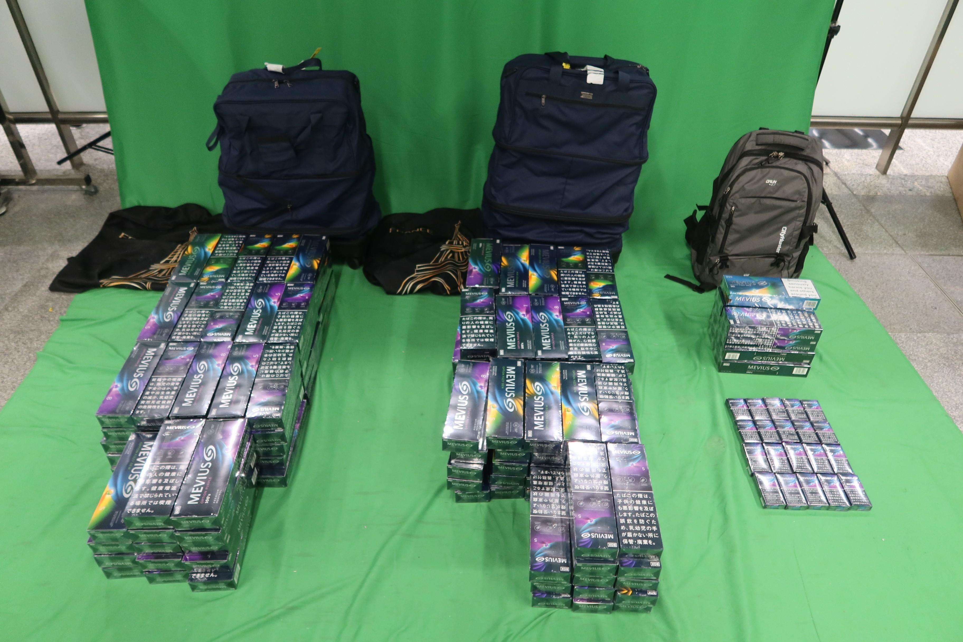 A 48-year-old incoming female passenger was sentenced to six months' imprisonment and fined $1,000 by the West Kowloon Magistrates' Courts today (December 2) for dealing with duty-not-paid cigarettes and failing to declare them to Customs officers, in contravention of the Dutiable Commodities Ordinance.  Photo shows the duty-not-paid cigarettes seized.