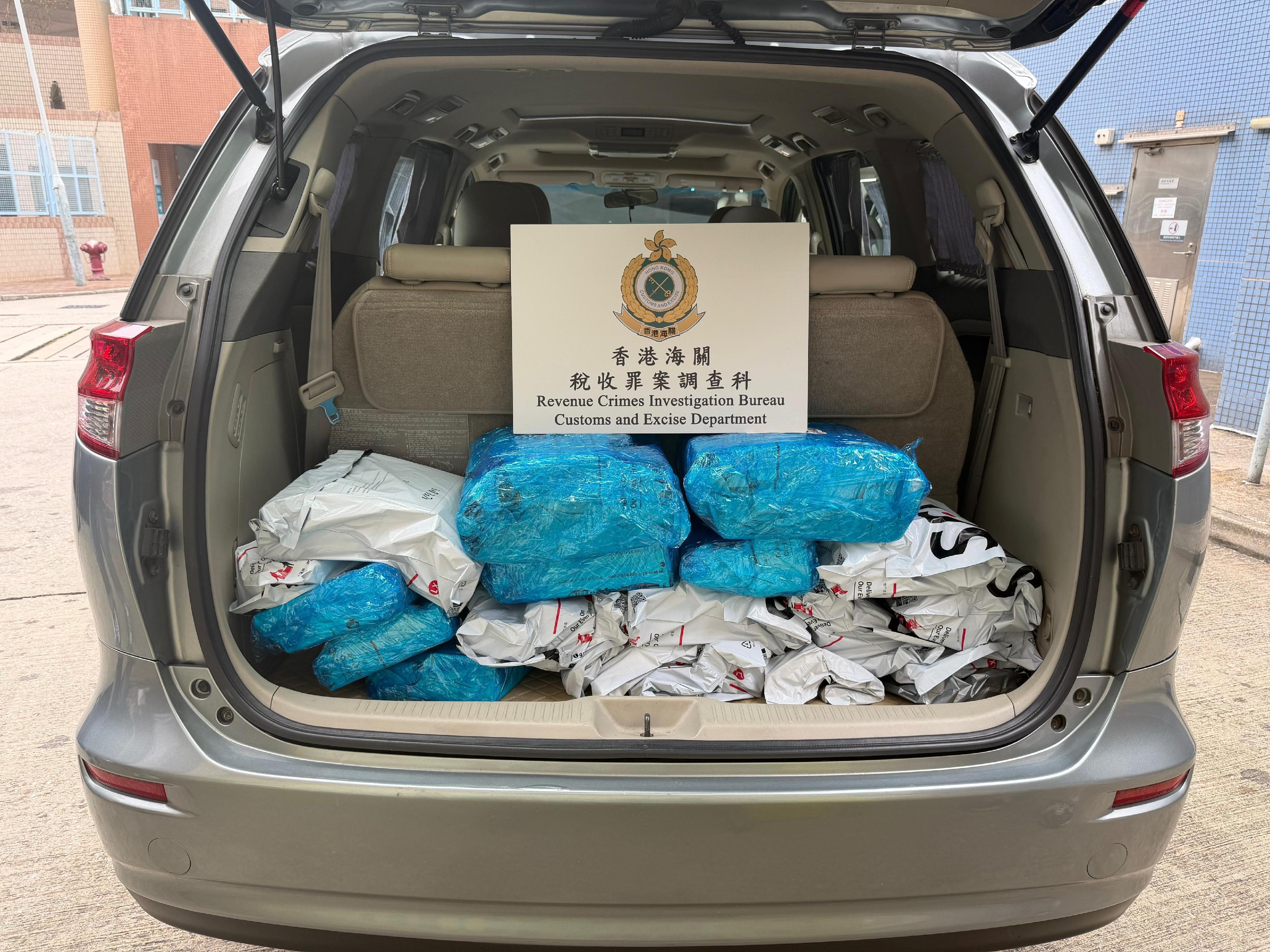 Hong Kong Customs detected a case of suspected illicit cigarette distribution  by telephone ordering yesterday (December 3) and seized about 19 000 suspected illicit cigarettes with an estimated market value of about $90,000 and a duty potential of about $60,000. One man was arrested. Photo shows the suspected illicit cigarette distribution vehicle detained and the suspected illicit cigarettes seized.