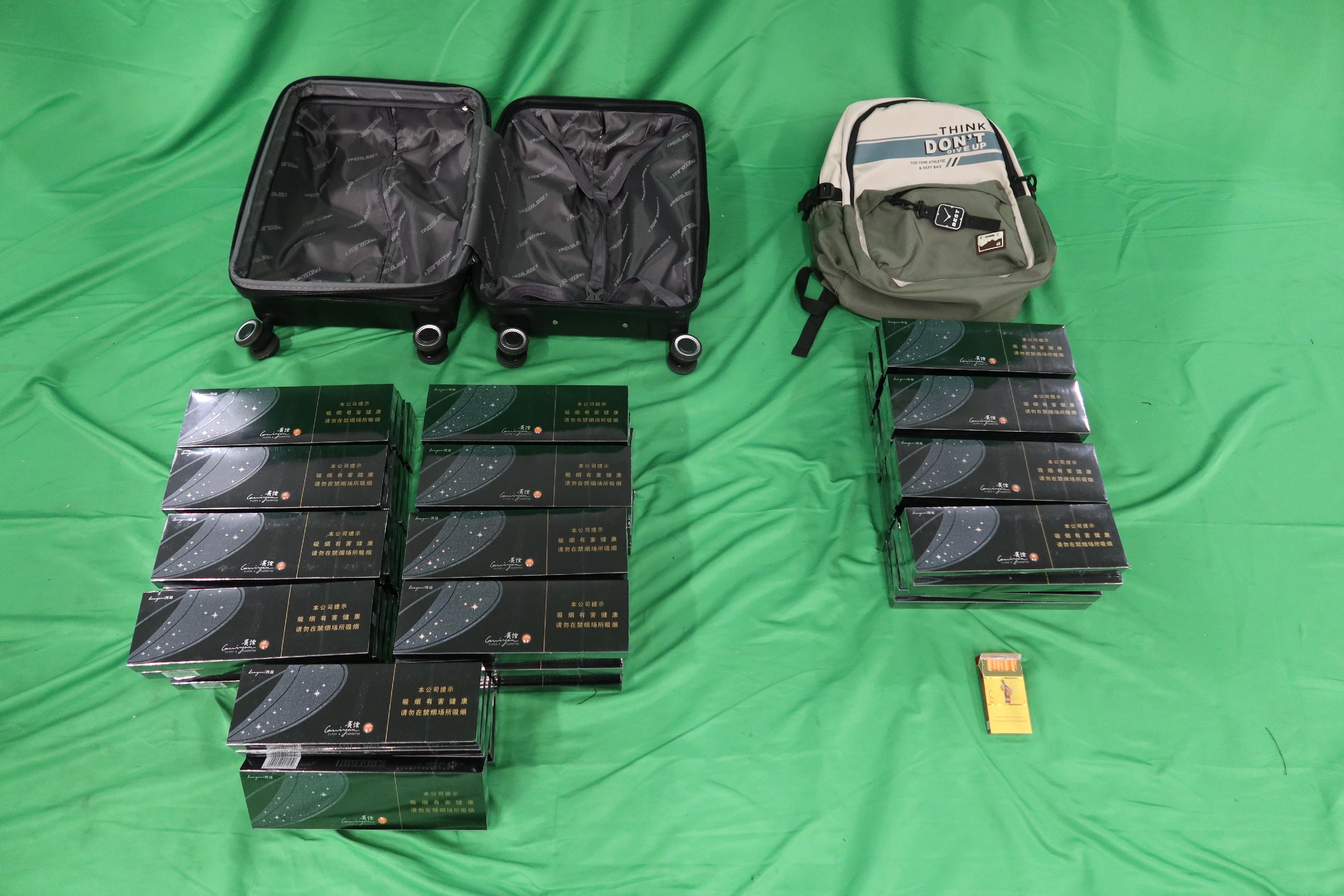 An incoming 32-year-old male passenger was sentenced to two months' imprisonment and fined $1,000 at the West Kowloon Magistrates' Courts today (December 6) for importing duty-not-paid cigarettes and failing to declare them to Customs officers in contravention of the Dutiable Commodities Ordinance. Photo shows the duty-not-paid cigarettes seized.