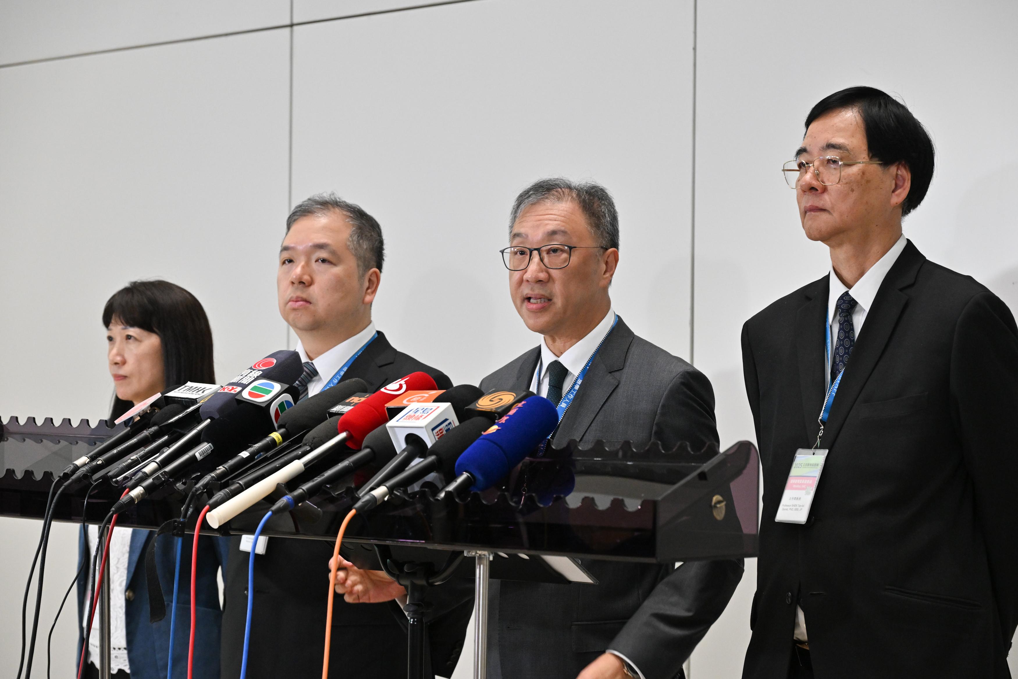 The Chairman of the Electoral Affairs Commission (EAC), Mr Justice David Lok (second right), and EAC members Professor Daniel Shek (first right) and Mr Bernard Man, SC (second left), meet the media after inspecting the Near Boundary Polling Station of the 2025 Legislative Council General Election at Hong Kong International Airport Terminal 2 this morning (December 7). Looking on is the Chief Electoral Officer of the Registration and Electoral Office, Ms Natalie Chan (first left).