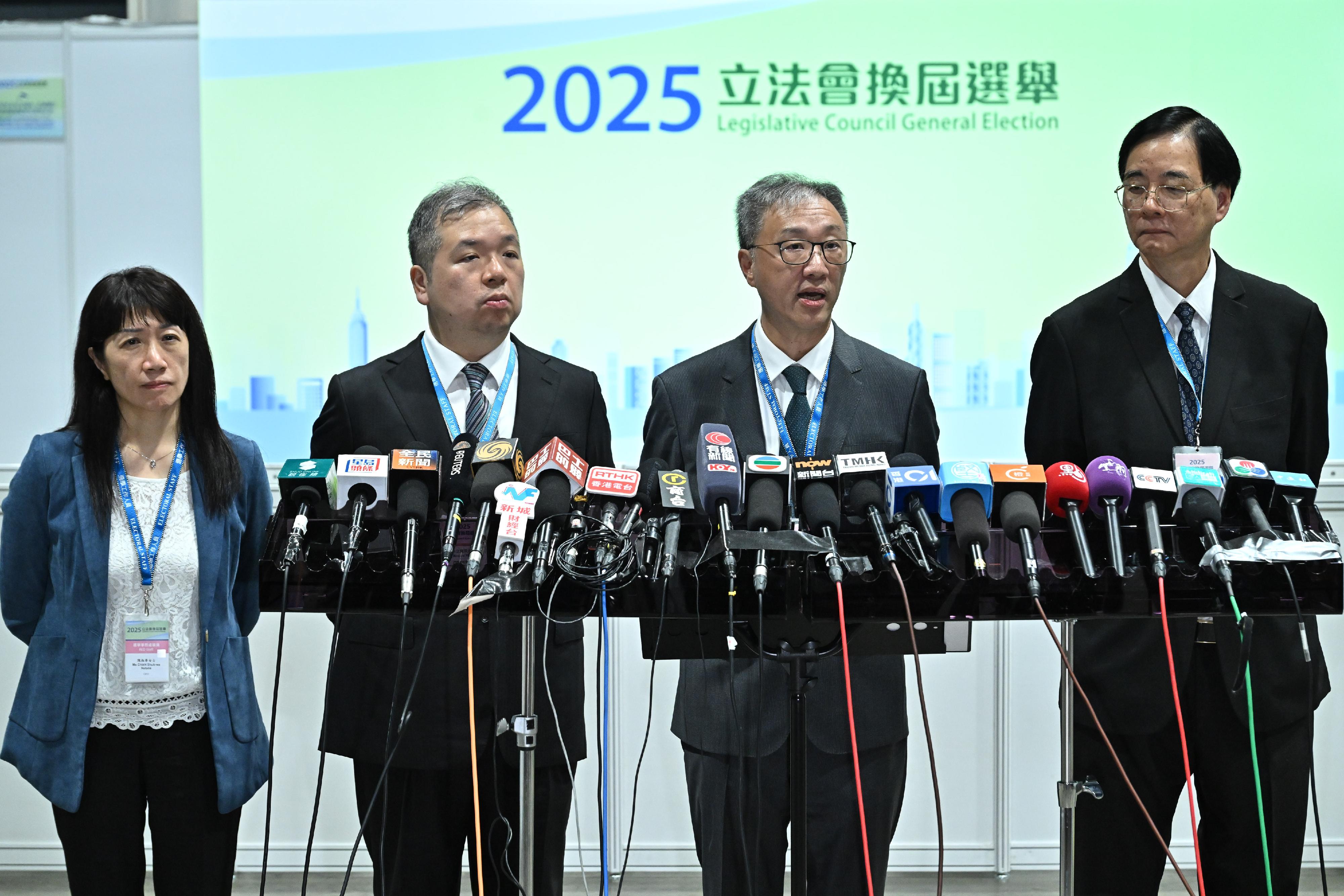 The Chairman of the Electoral Affairs Commission (EAC), Mr Justice David Lok (second right), meets the media in the small hours today (December 8) at the Media Centre of the 2025 Legislative Council General Election located at the Hong Kong Convention and Exhibition Centre to conclude the polling arrangements. Also present are EAC members Professor Daniel Shek (first right) and Mr Bernard Man, SC (second left), and the Chief Electoral Officer of the Registration and Electoral Office, Ms Natalie Chan (first left).