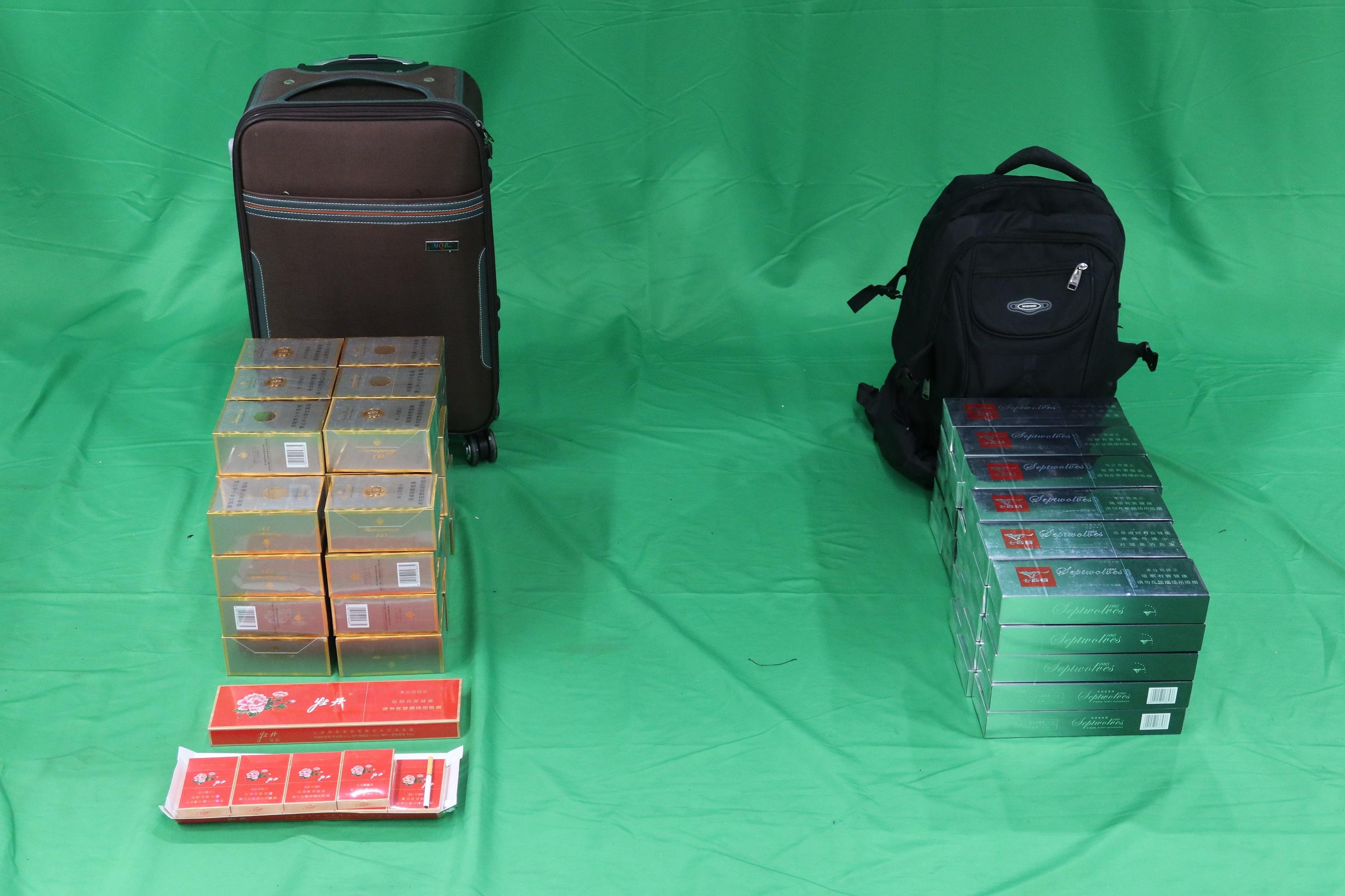 An incoming 31-year-old male passenger was sentenced to three months' imprisonment and fined $2,000 by the West Kowloon Magistrates' Courts today (December 8) for importing duty-not-paid cigarettes and failing to declare them to Customs officers, in contravention of the Dutiable Commodities Ordinance. Photo shows the duty-not-paid cigarettes seized.
