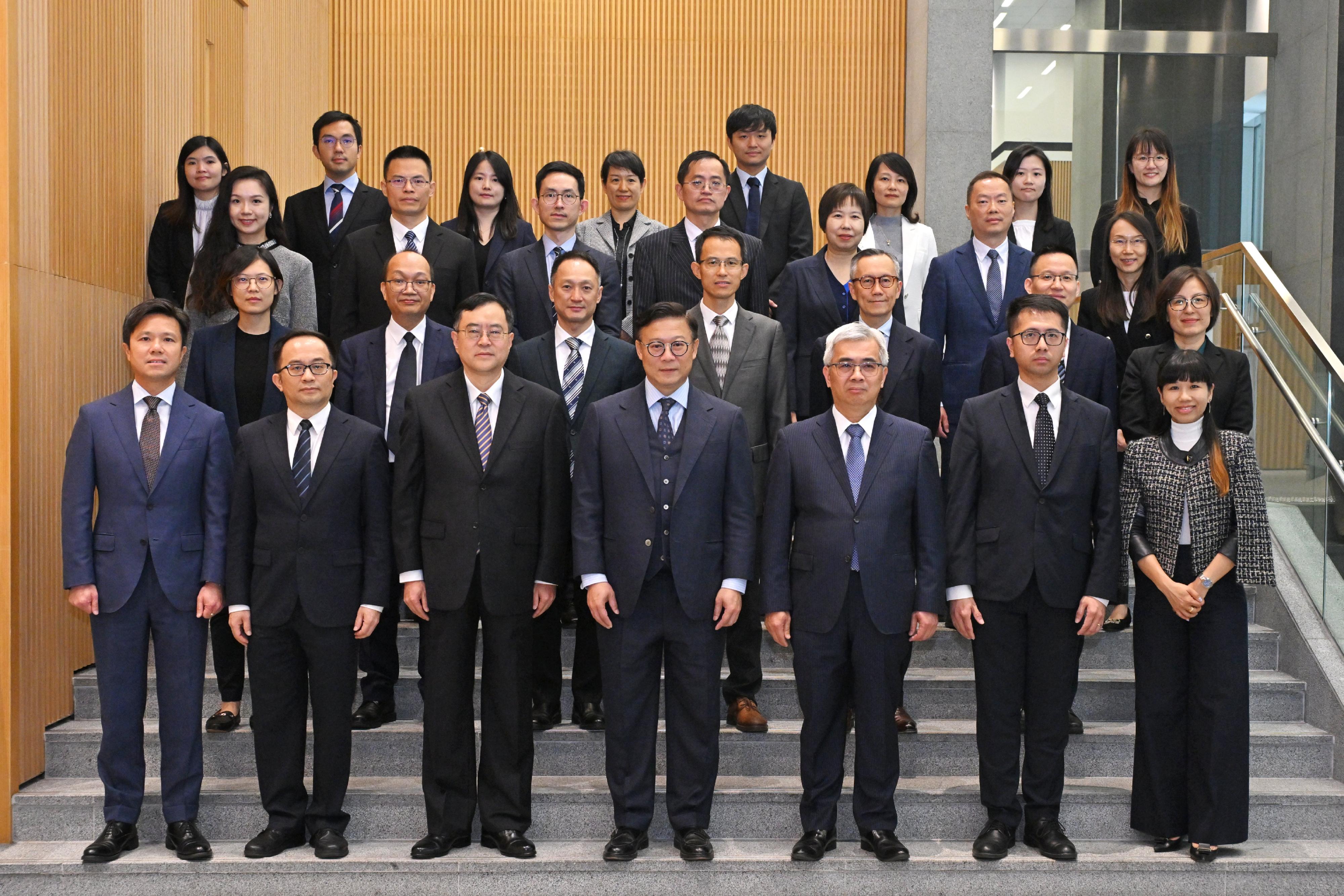 The Deputy Secretary for Justice, Dr Cheung Kwok-kwan, today (December 9) hosted the seventh Guangdong-Hong Kong-Macao Greater Bay Area Legal Departments Joint Conference. Photo shows Dr Cheung (front row, centre); the Director-General of the Department of Justice of Guangdong Province, Mr Chen Xudong (front row, third left); the Secretary for Administration and Justice of the Macao Special Administrative Region Government, Mr Wong Sio Chak (front row, third right); and legal department officers of the three places before attending the Joint Conference.