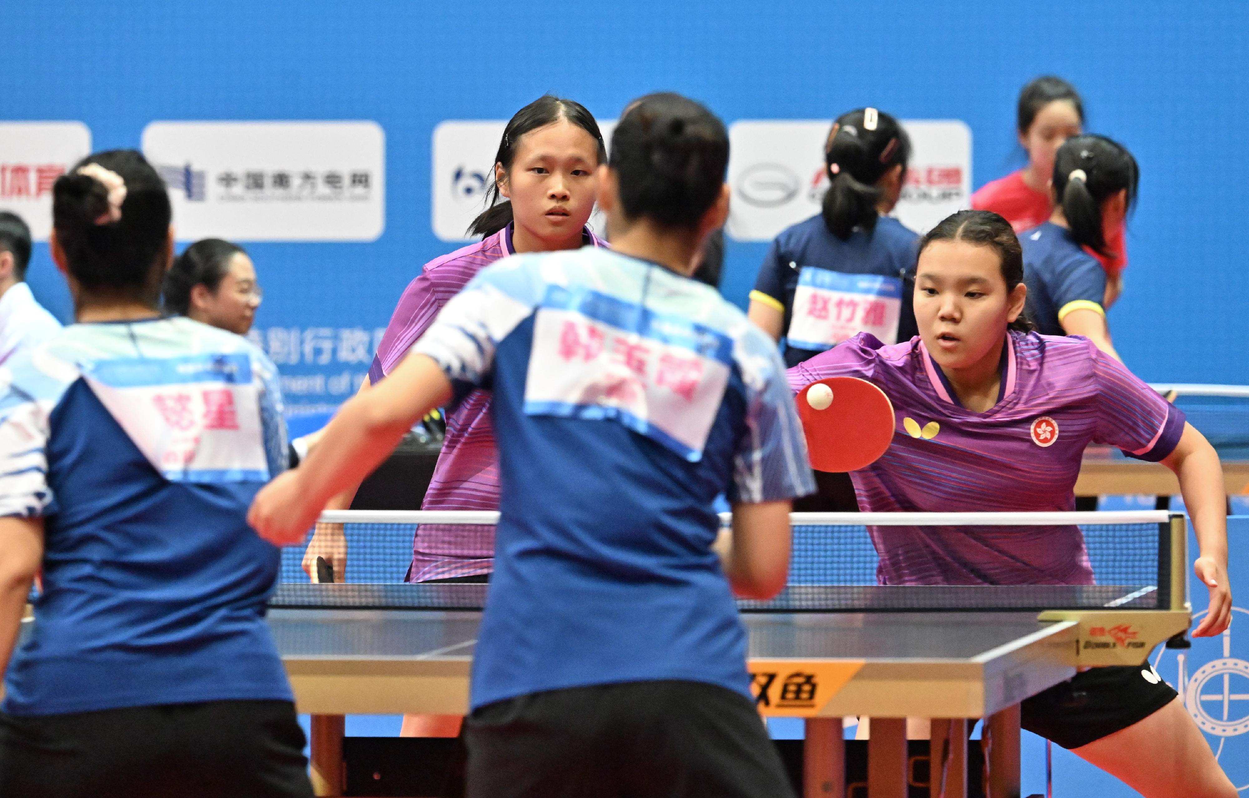 The National Special Olympic Games table tennis competition of the 12th National Games for Persons with Disabilities and the 9th National Special Olympic Games was held today (December 6) at Tsuen Wan Sports Centre. Photo shows athletes competing in the women's doubles.