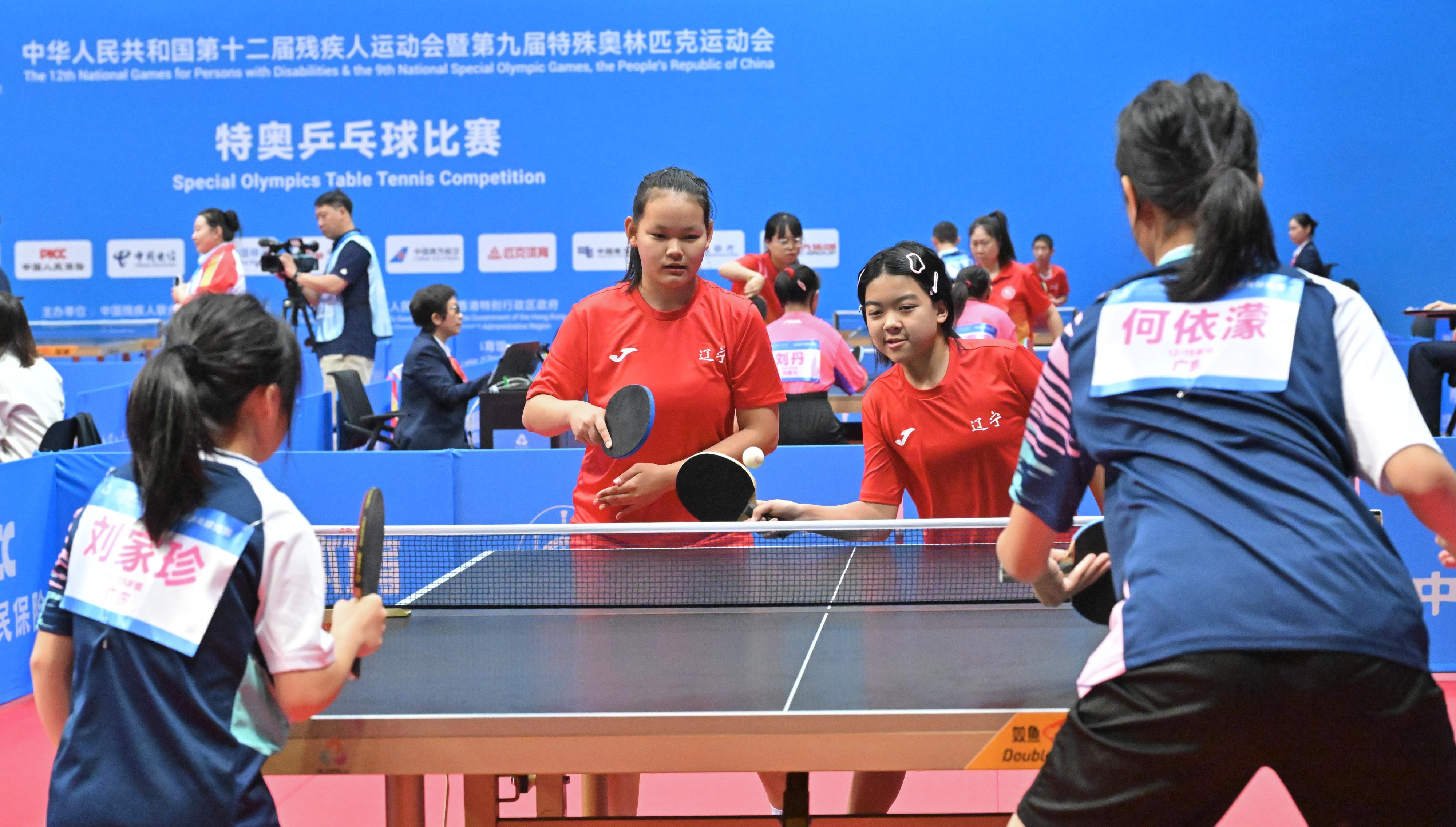 The National Special Olympic Games table tennis competition of the 12th National Games for Persons with Disabilities and the 9th National Special Olympic Games was held today (December 6) at Tsuen Wan Sports Centre. Photo shows athletes competing in the women's doubles.