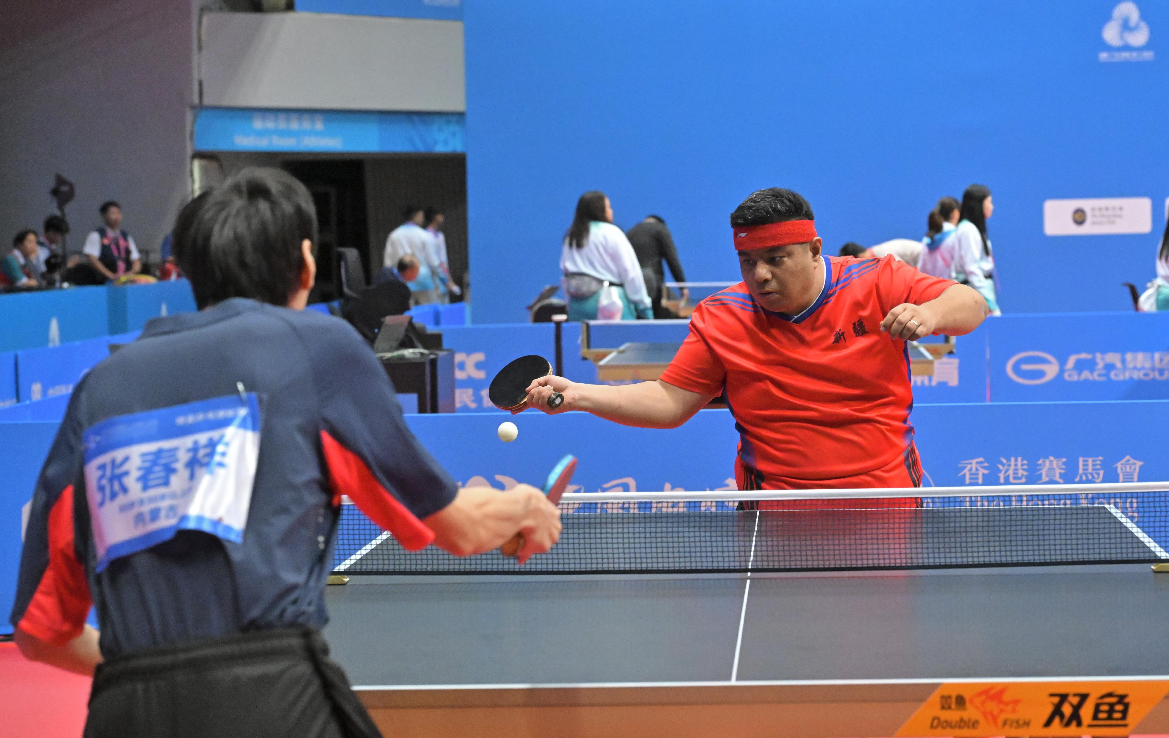 The National Special Olympic Games table tennis competition of the 12th National Games for Persons with Disabilities and the 9th National Special Olympic Games was held today (December 6) at Tsuen Wan Sports Centre. Photo shows athletes competing in the men's singles.