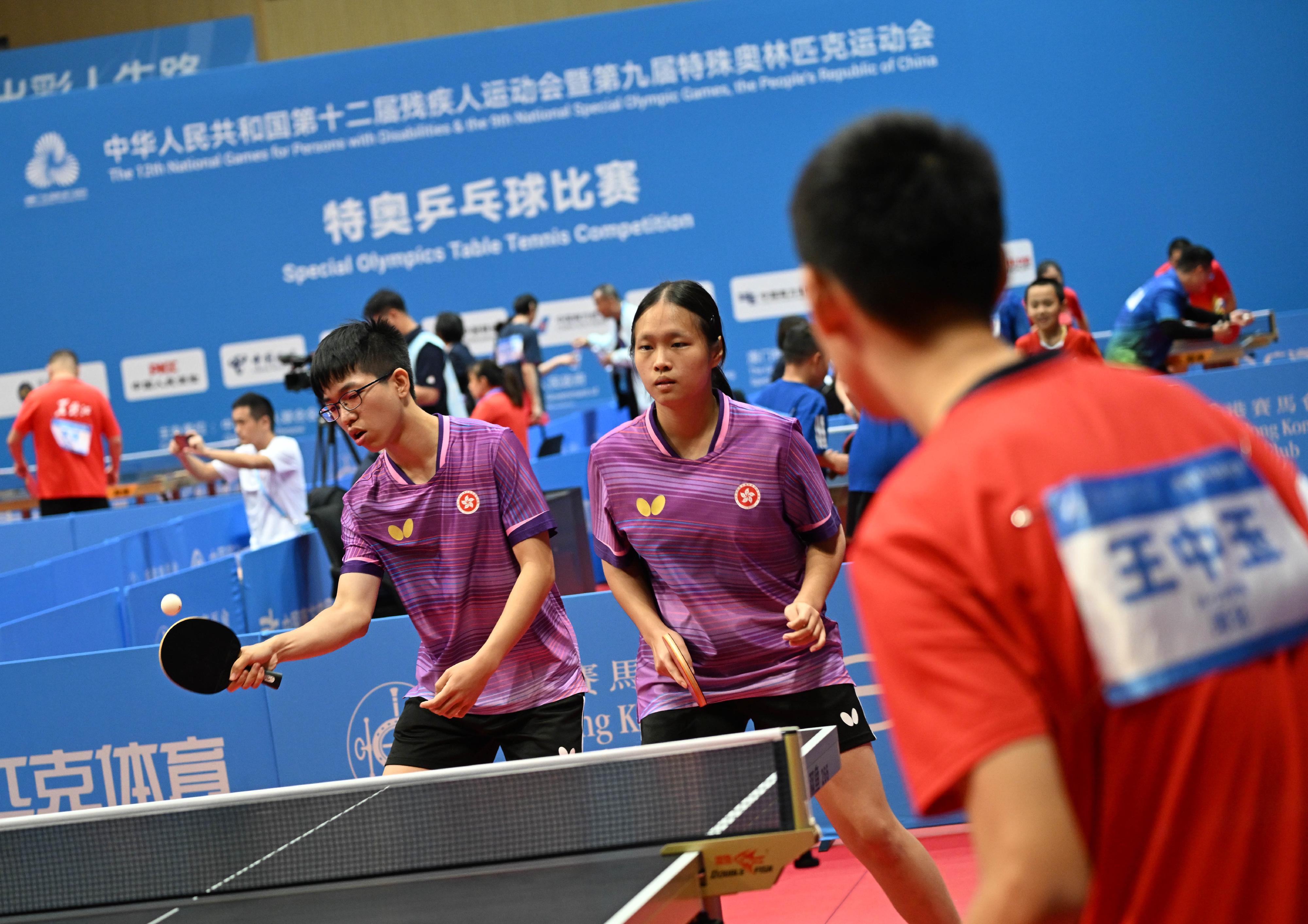 The National Special Olympic Games table tennis competition of the 12th National Games for Persons with Disabilities and the 9th National Special Olympic Games was held today (December 8) at Tsuen Wan Sports Centre. Photo shows athletes competing in the mixed doubles event.