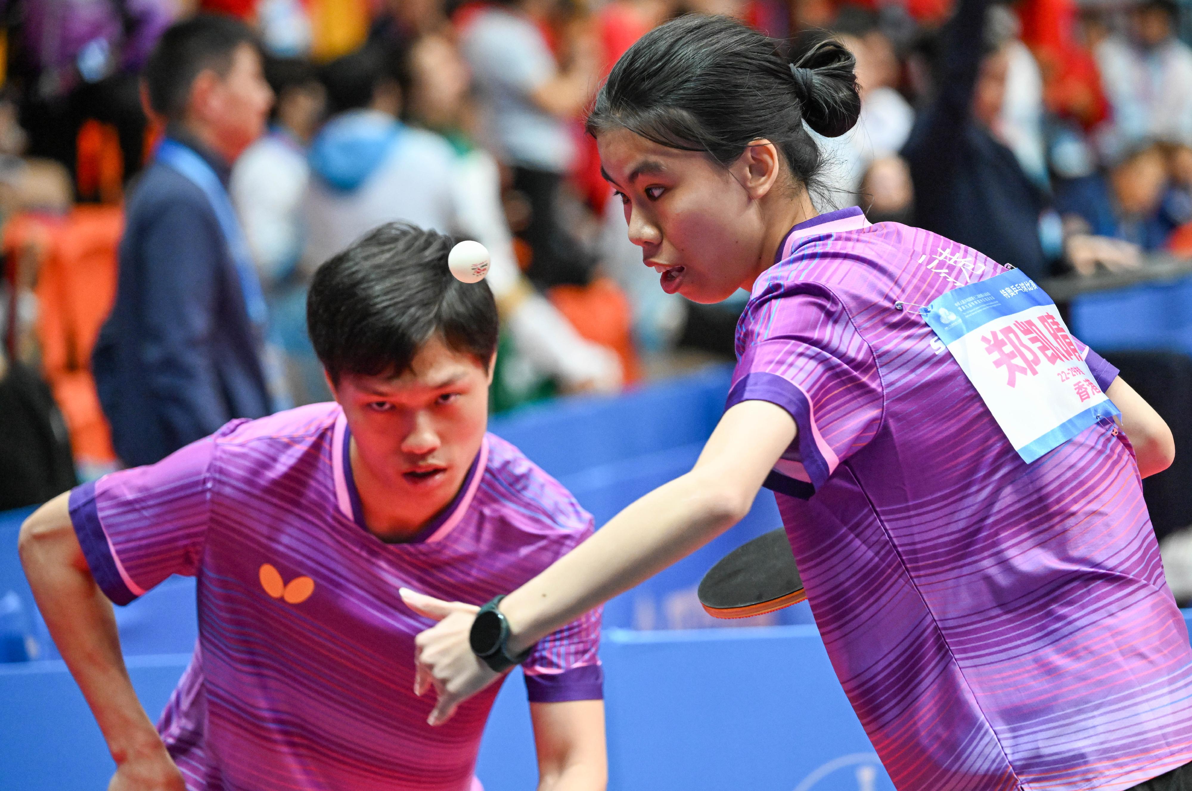 The National Special Olympic Games table tennis competition of the 12th National Games for Persons with Disabilities and the 9th National Special Olympic Games was held today (December 8) at Tsuen Wan Sports Centre. Photo shows athletes competing in the mixed doubles event.