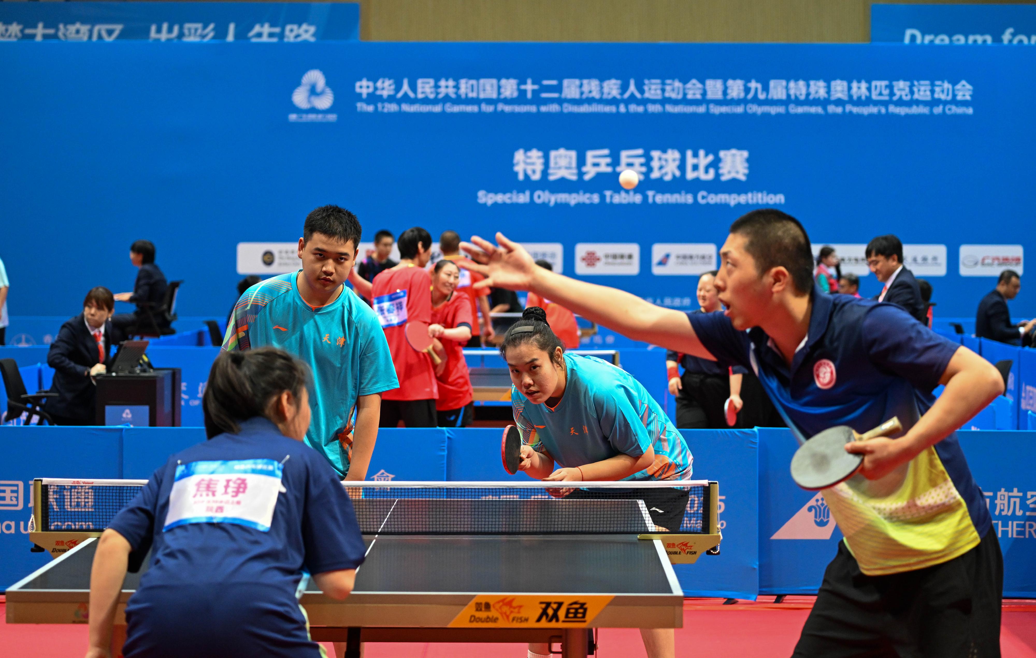 The National Special Olympic Games table tennis competition of the 12th National Games for Persons with Disabilities and the 9th National Special Olympic Games was held today (December 8) at Tsuen Wan Sports Centre. Photo shows athletes competing in the mixed doubles event.
