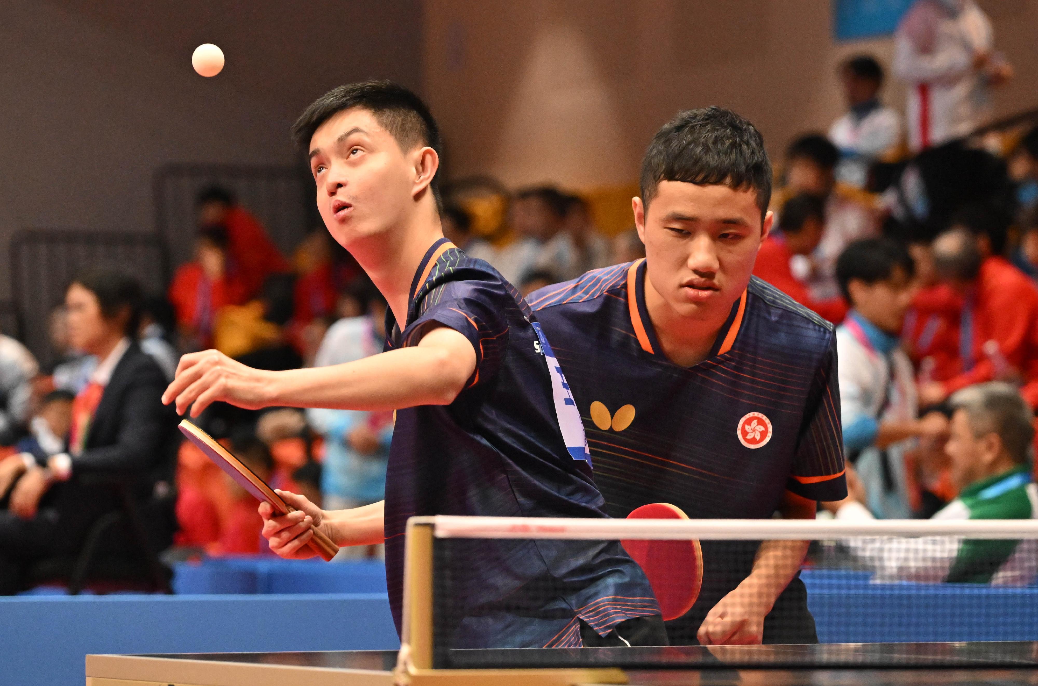 The National Special Olympic Games table tennis competition of the 12th National Games for Persons with Disabilities and the 9th National Special Olympic Games was held today (December 9) at Tsuen Wan Sports Centre. Photo shows athletes competing in the men’s doubles event.