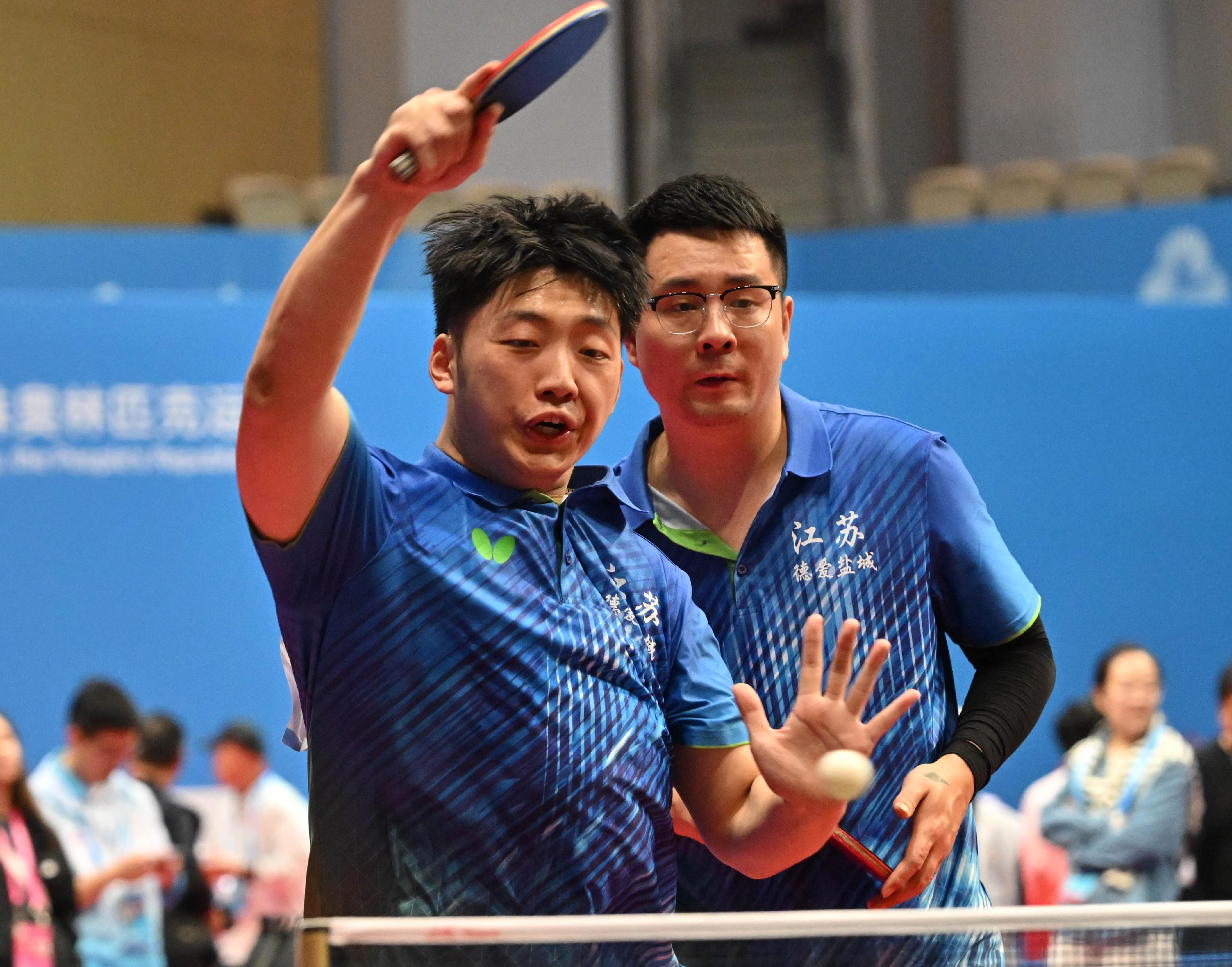 The National Special Olympic Games table tennis competition of the 12th National Games for Persons with Disabilities and the 9th National Special Olympic Games was held today (December 9) at Tsuen Wan Sports Centre. Photo shows athletes competing in the men’s doubles event.
