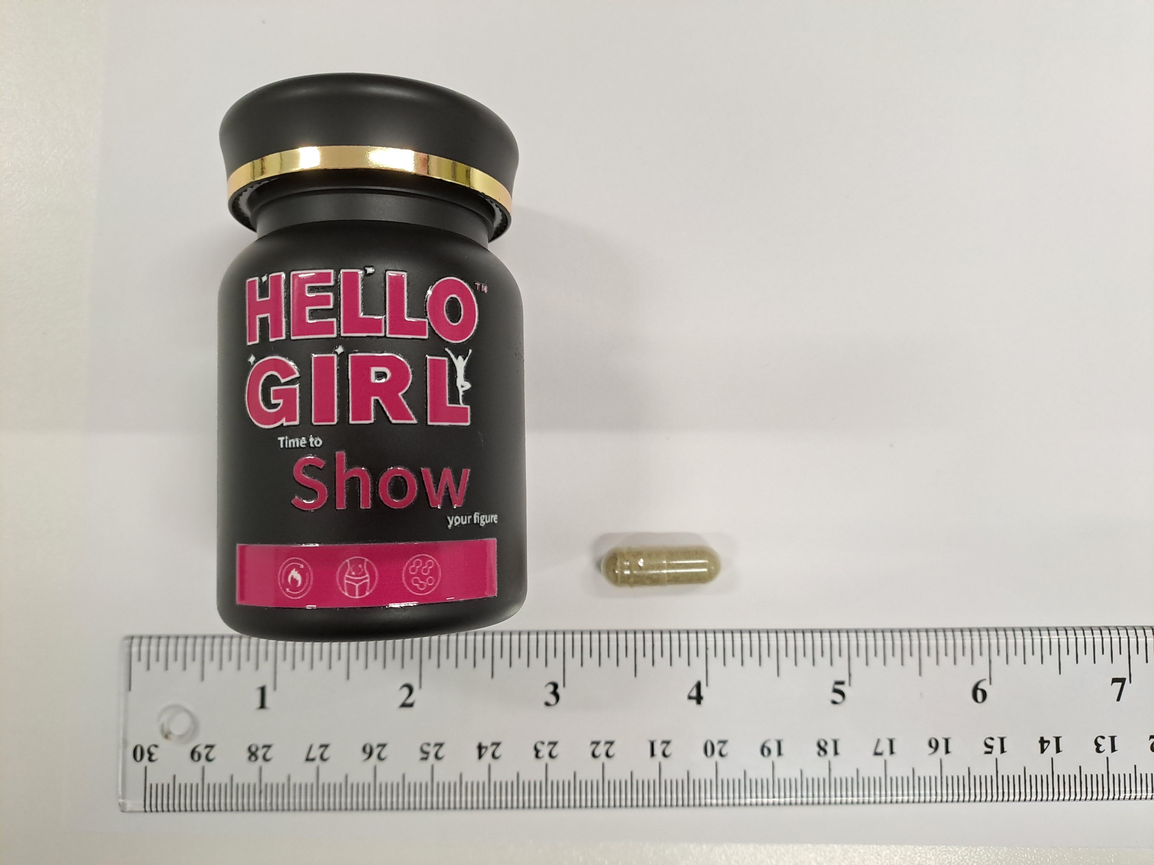 In response to suspected illegal sales of slimming products containing banned and undeclared controlled drug ingredients on social media platforms, the Department of Health today (December 11) carried out enforcement operations in Tseung Kwan O and Tai Po with the Police. Photo shows a capsule sample that was packaged in a black plastic container labelled "HELLO GIRL time to show your figure".
