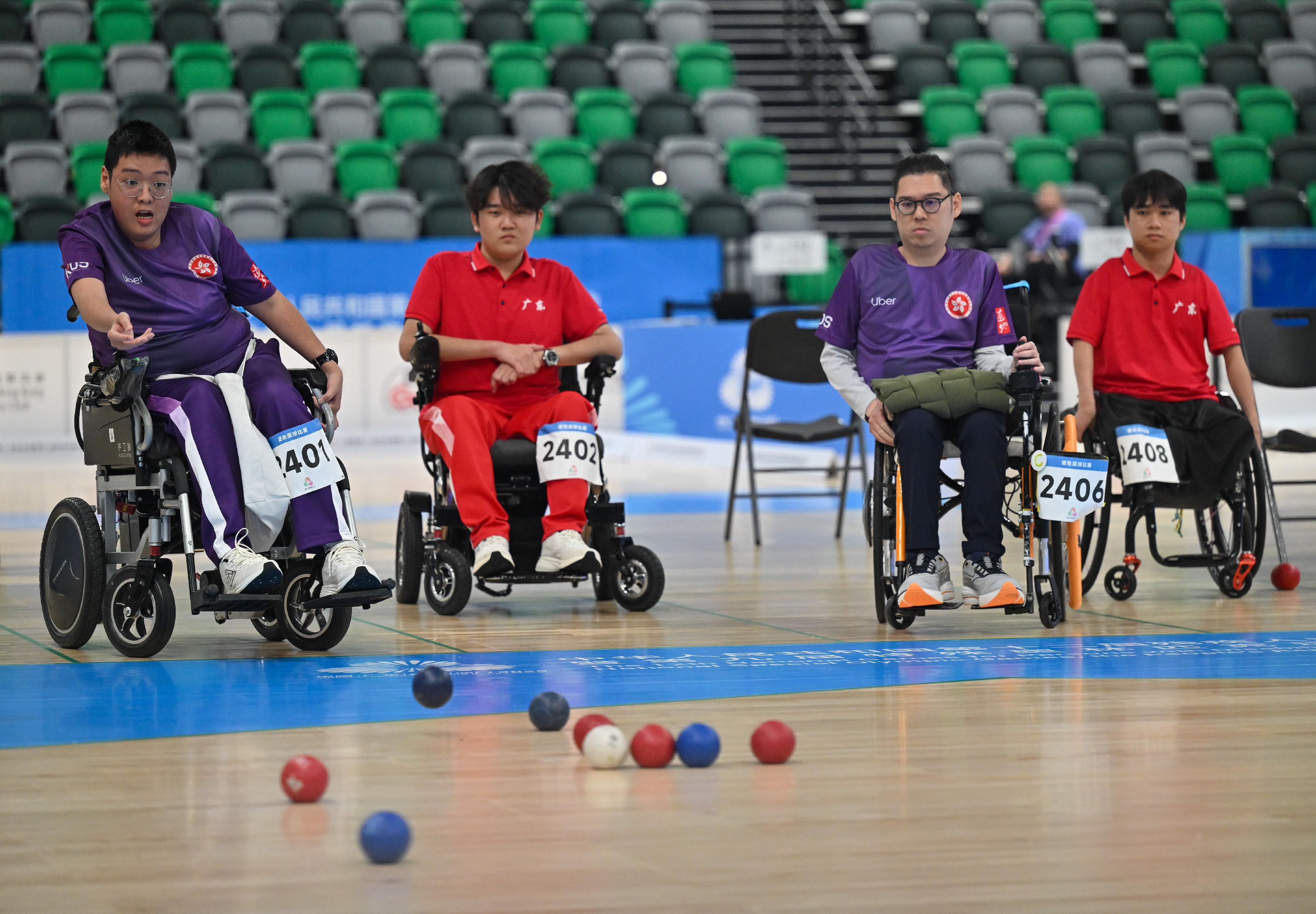 The double and group finals of the boccia competition of the 12th National Games for Persons with Disabilities and the 9th National Special Olympic Games was held at Kai Tak Arena, Kai Tak Sports Park today (December 14). Photo shows Hong Kong athletes competing at the Men's Double BC4 event.