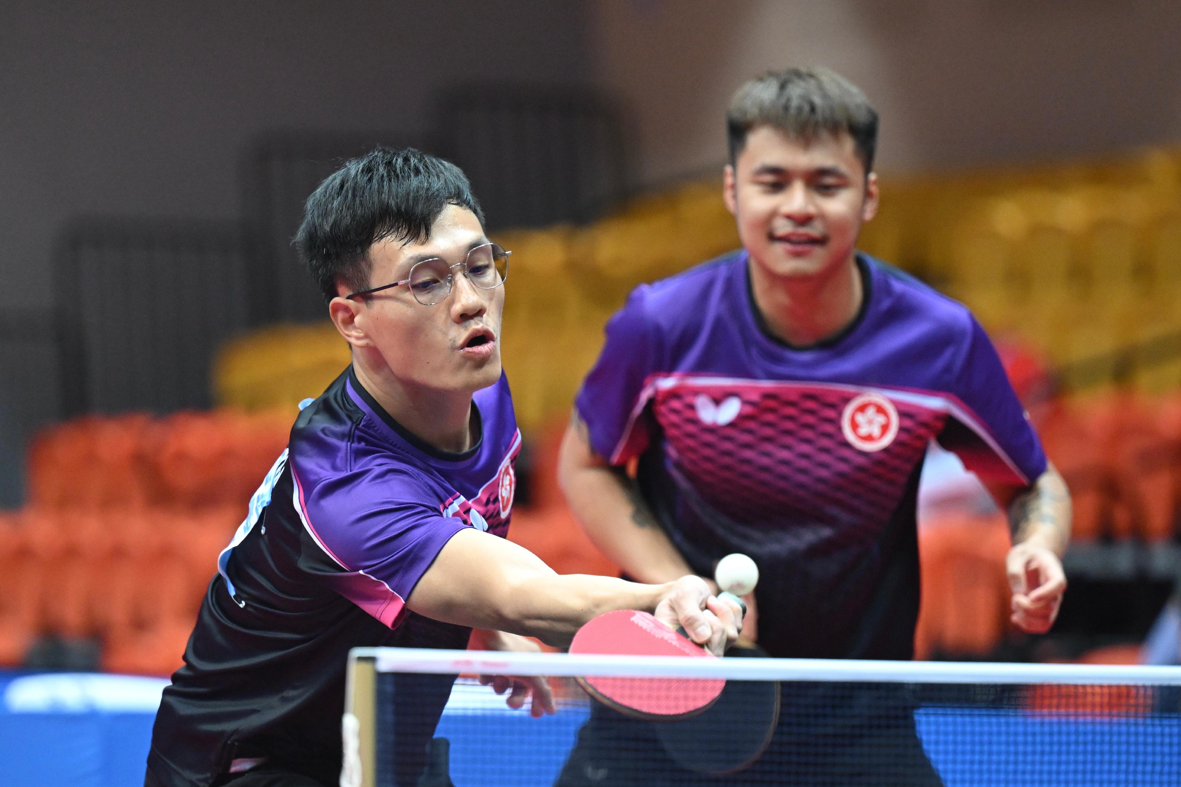 The Hong Kong Jockey Club Trophy para table tennis (TT11) competition of the 12th National Games for Persons with Disabilities and the 9th National Special Olympic Games was held today (December 14) at Tsuen Wan Sports Centre. Photo shows athletes competing in the men's doubles event.