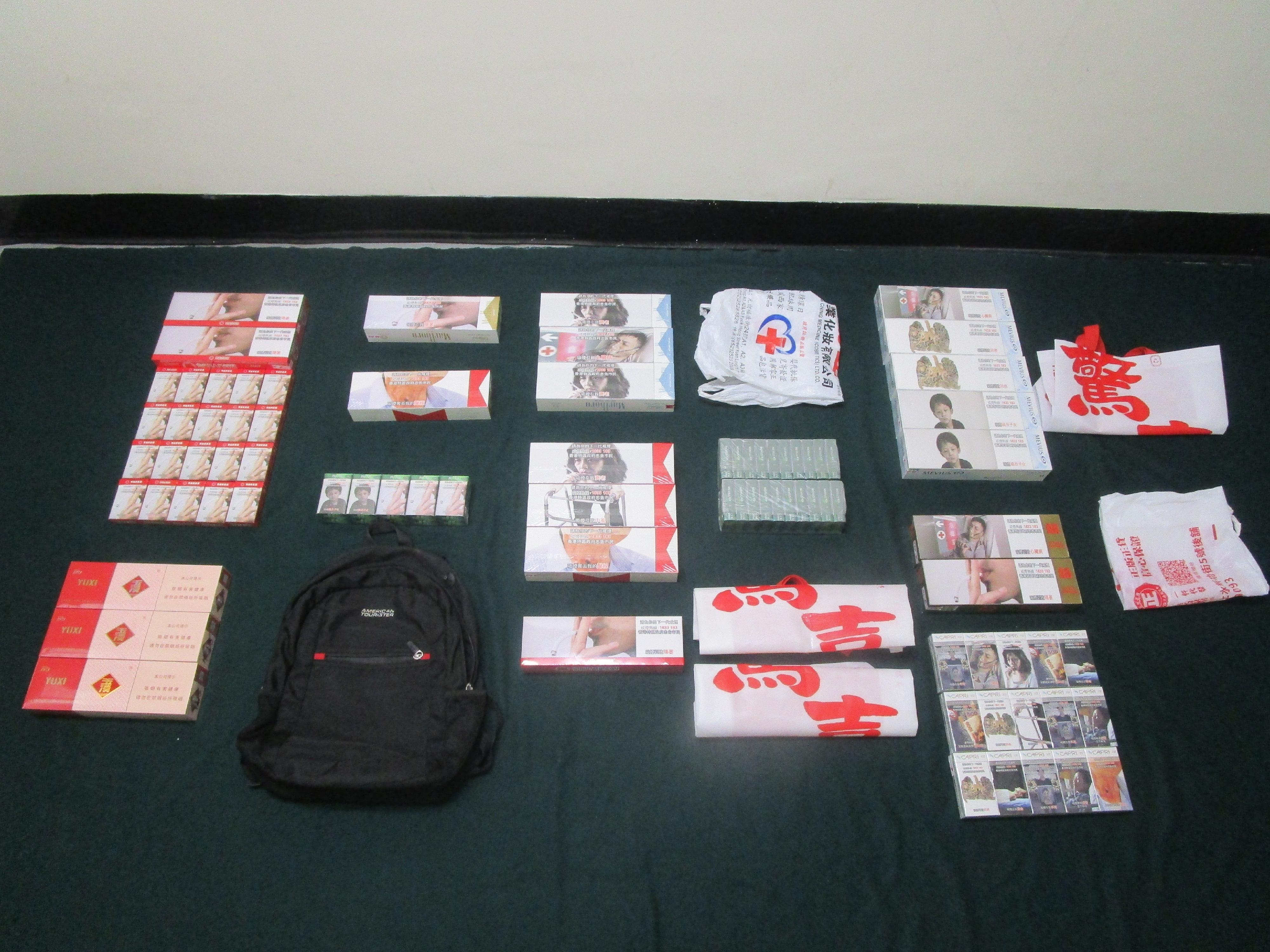 A 37-year-old incoming female passenger was sentenced to four weeks' imprisonment and fined $300 by the Fanling Magistrates' Courts today (December 15) for possessing duty-not-paid cigarettes and failing to declare them to Customs officers, in contravention of the Dutiable Commodities Ordinance. Photo shows the duty-not-paid cigarettes seized.