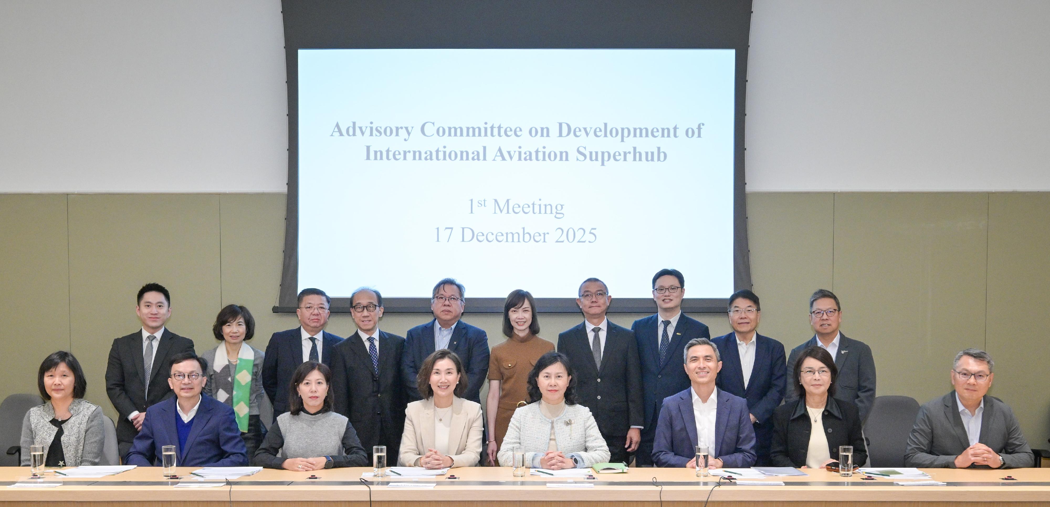 The Advisory Committee on Development of International Aviation Superhub, chaired by the Secretary for Transport and Logistics, Ms Mable Chan, convened its first meeting today (December 17). Photo shows Ms Chan (front row, fourth right); the Permanent Secretary for Transport and Logistics, Mr Vic Yau (front row, third right); the Under Secretary for Transport and Logistics, Mr Liu Chun-san (front row, second left); the Director-General of Civil Aviation, Mr Victor Liu (front row, first right), and committee members before the meeting.